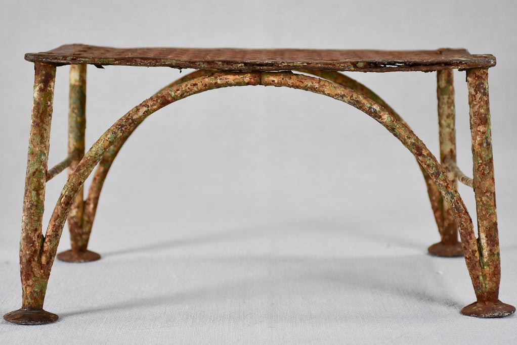 Early-20th-century wrought iron garden foot rest