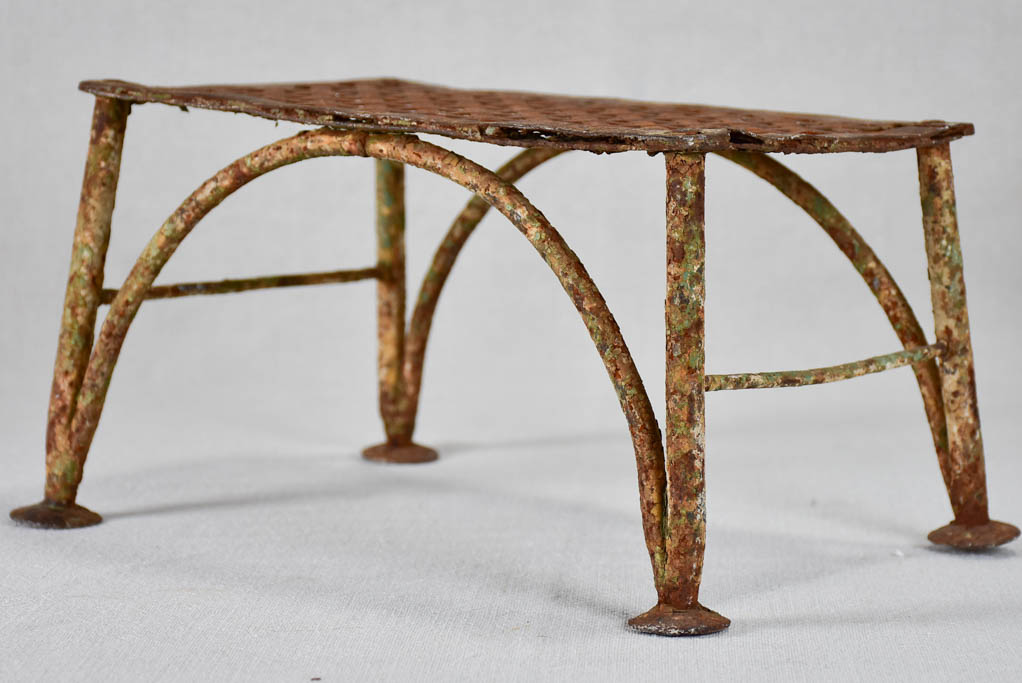 Early-20th-century wrought iron garden foot rest