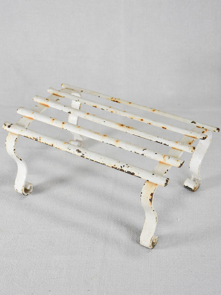 Early-twentieth-century wrought iron garden footrest with white patina