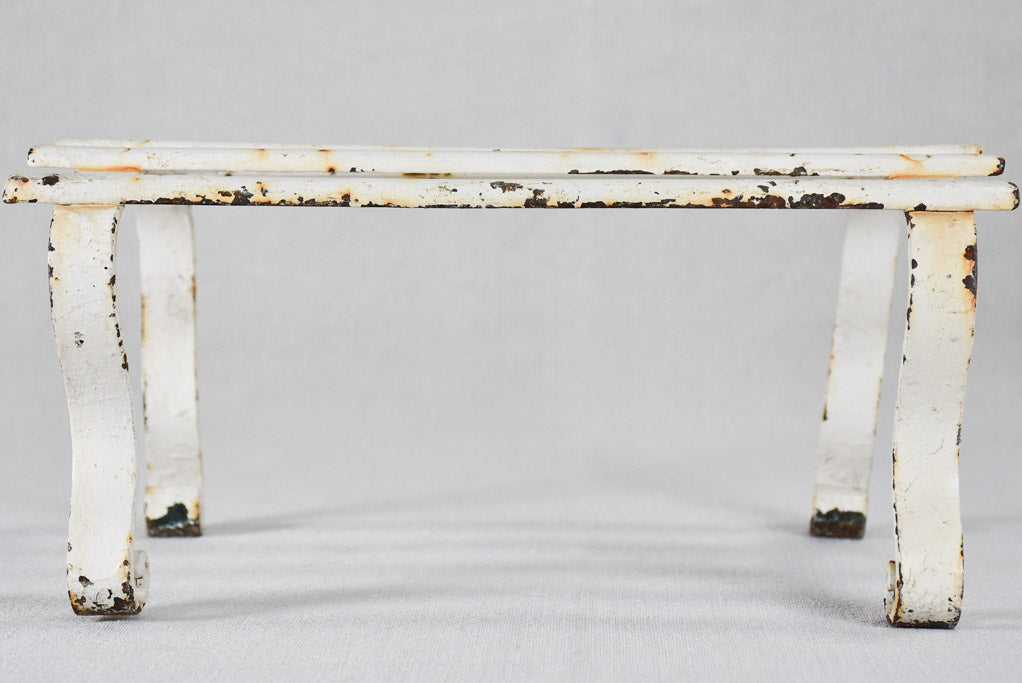 Early-twentieth-century wrought iron garden footrest with white patina