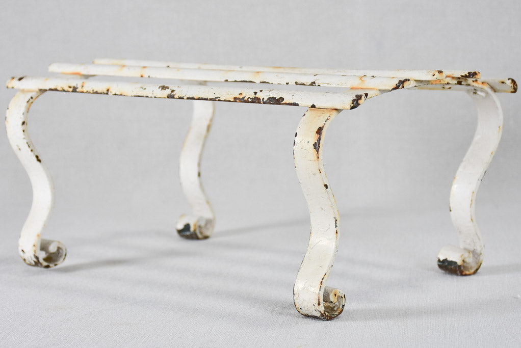 Early-twentieth-century wrought iron garden footrest with white patina