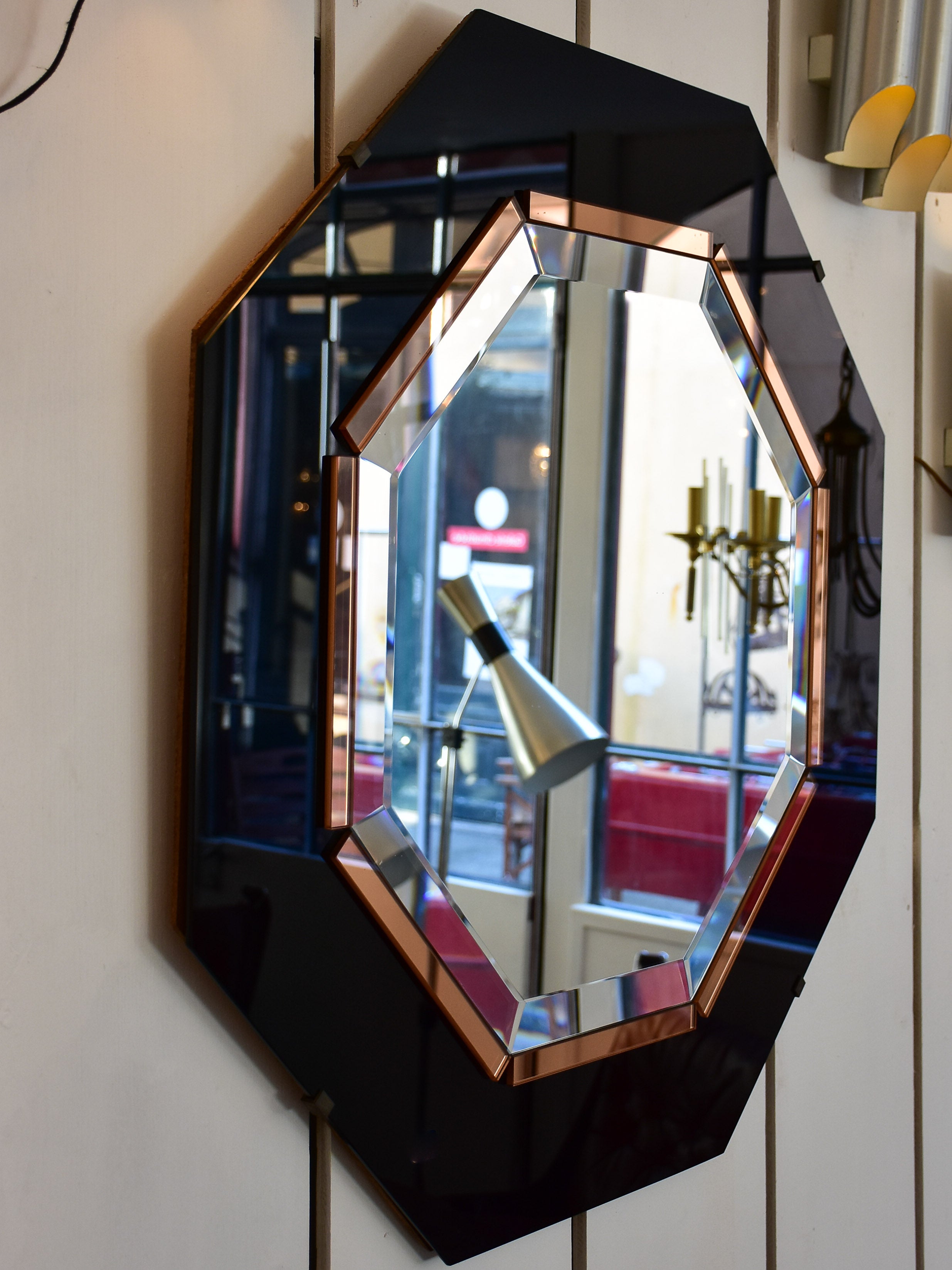 Octagonal mirror with black and pink glass frame