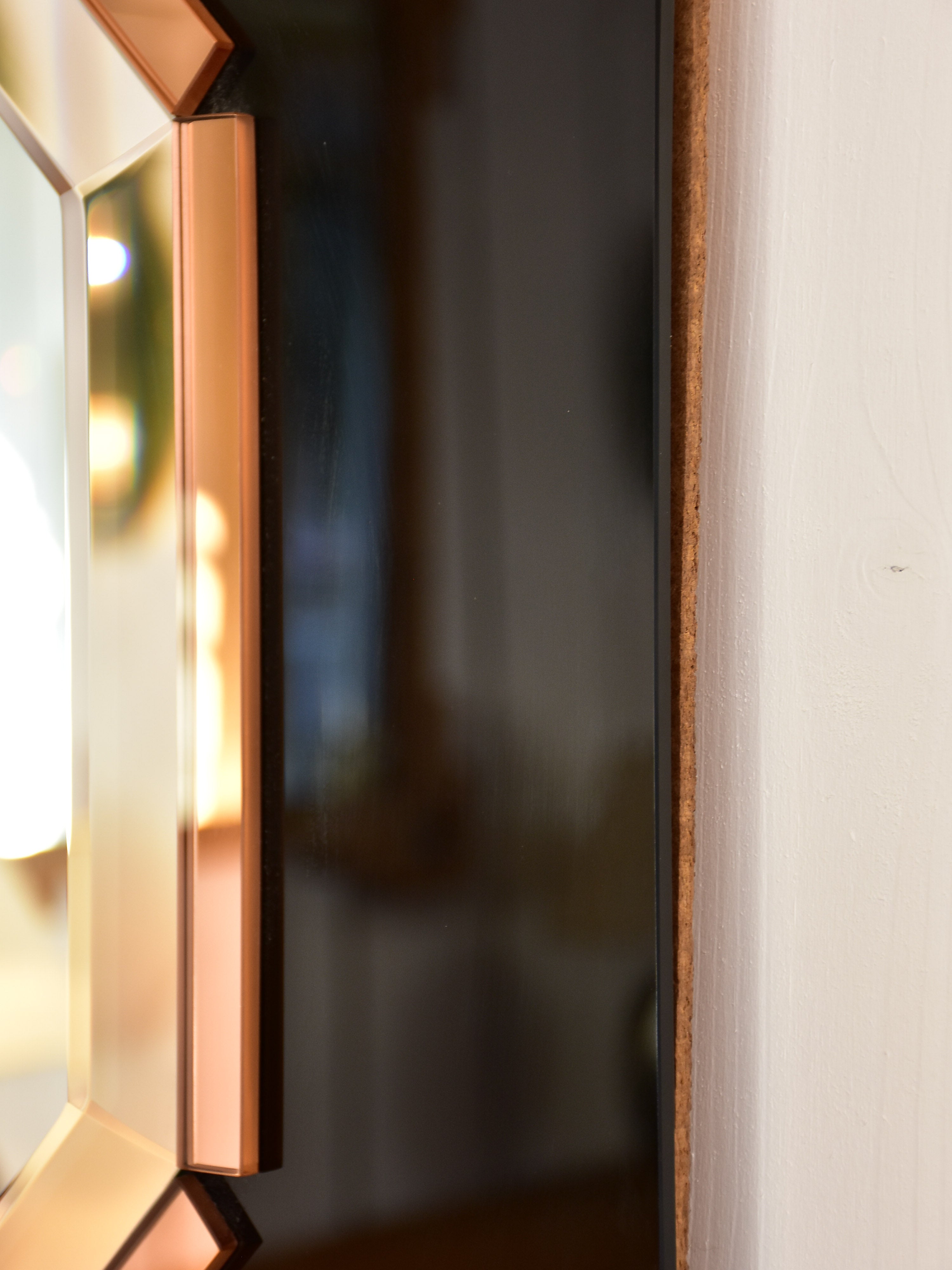 Octagonal mirror with black and pink glass frame