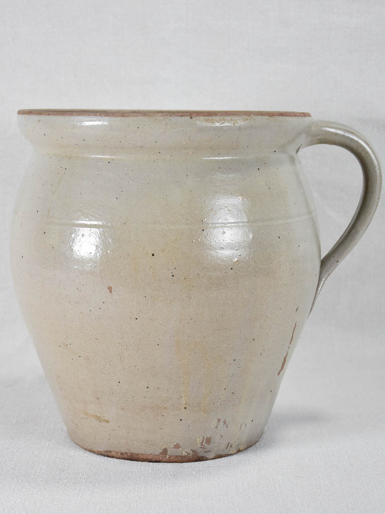 Early-twentieth-century French ceramic pitcher with beige glaze