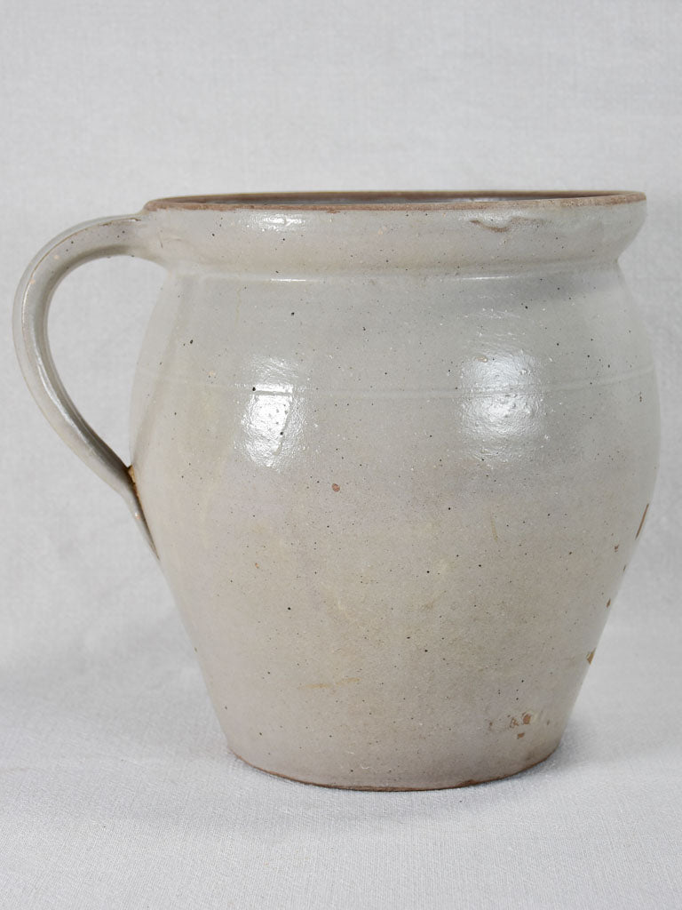 Early-twentieth-century French ceramic pitcher with beige glaze