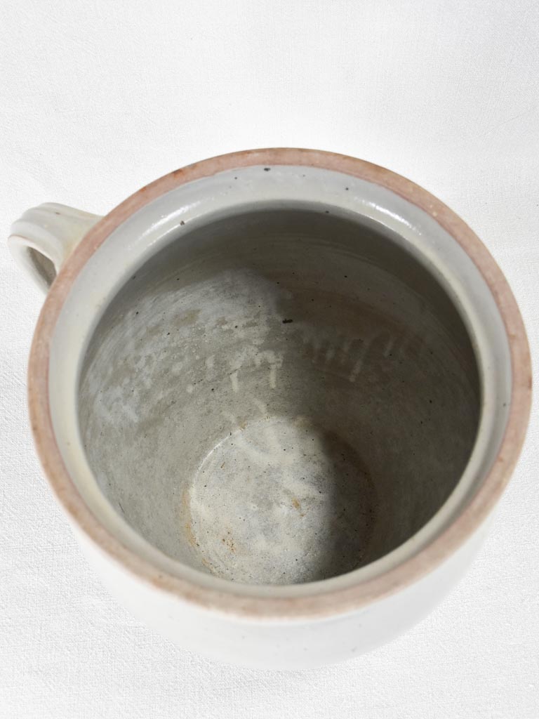 Early-twentieth-century French ceramic pitcher with beige glaze