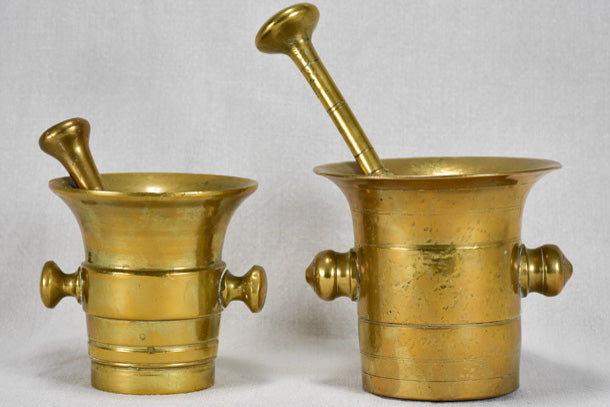 Two early twentieth-century bronze mortars and pestles