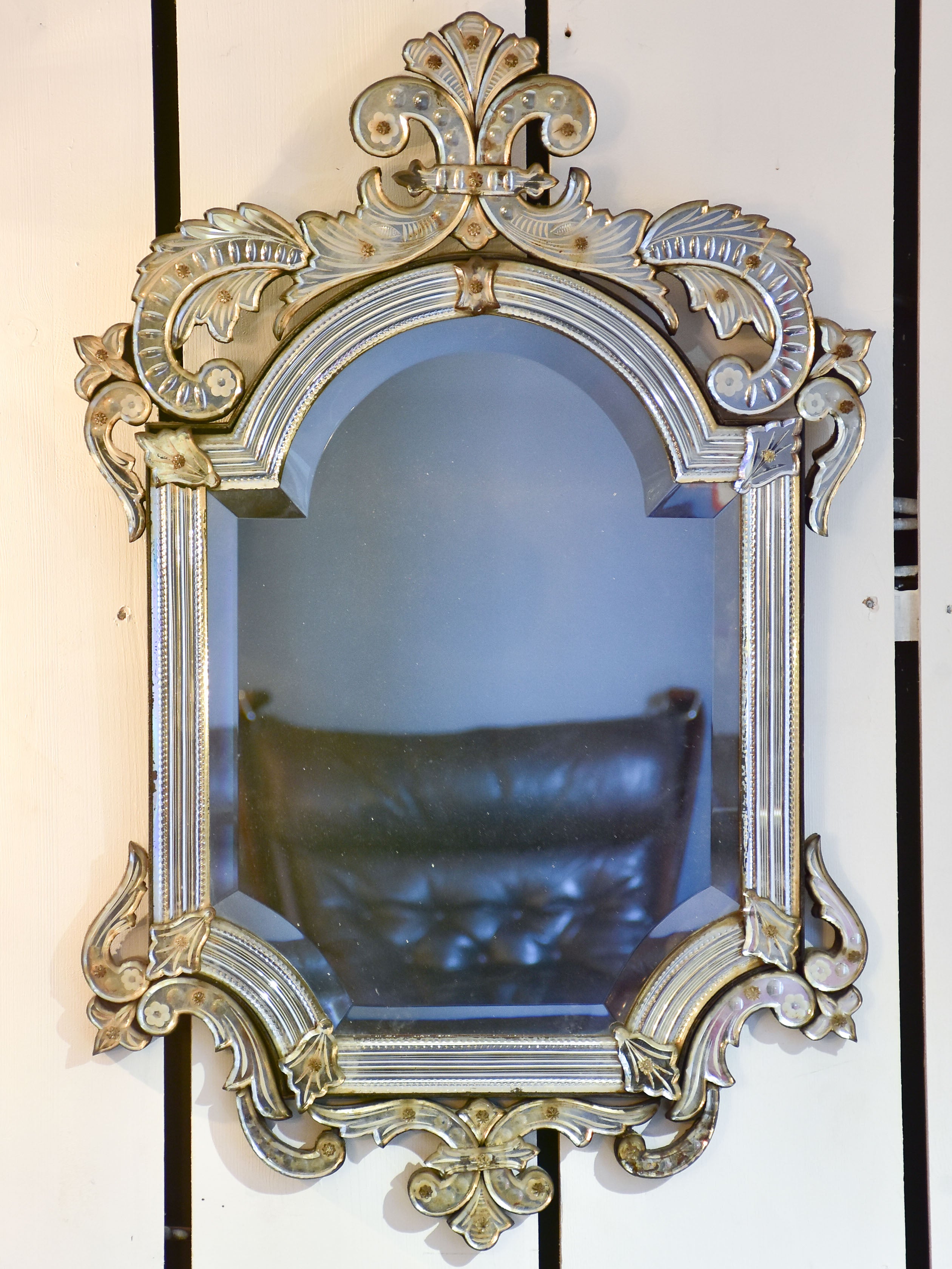 Antique Venetian mirror with decorative frame