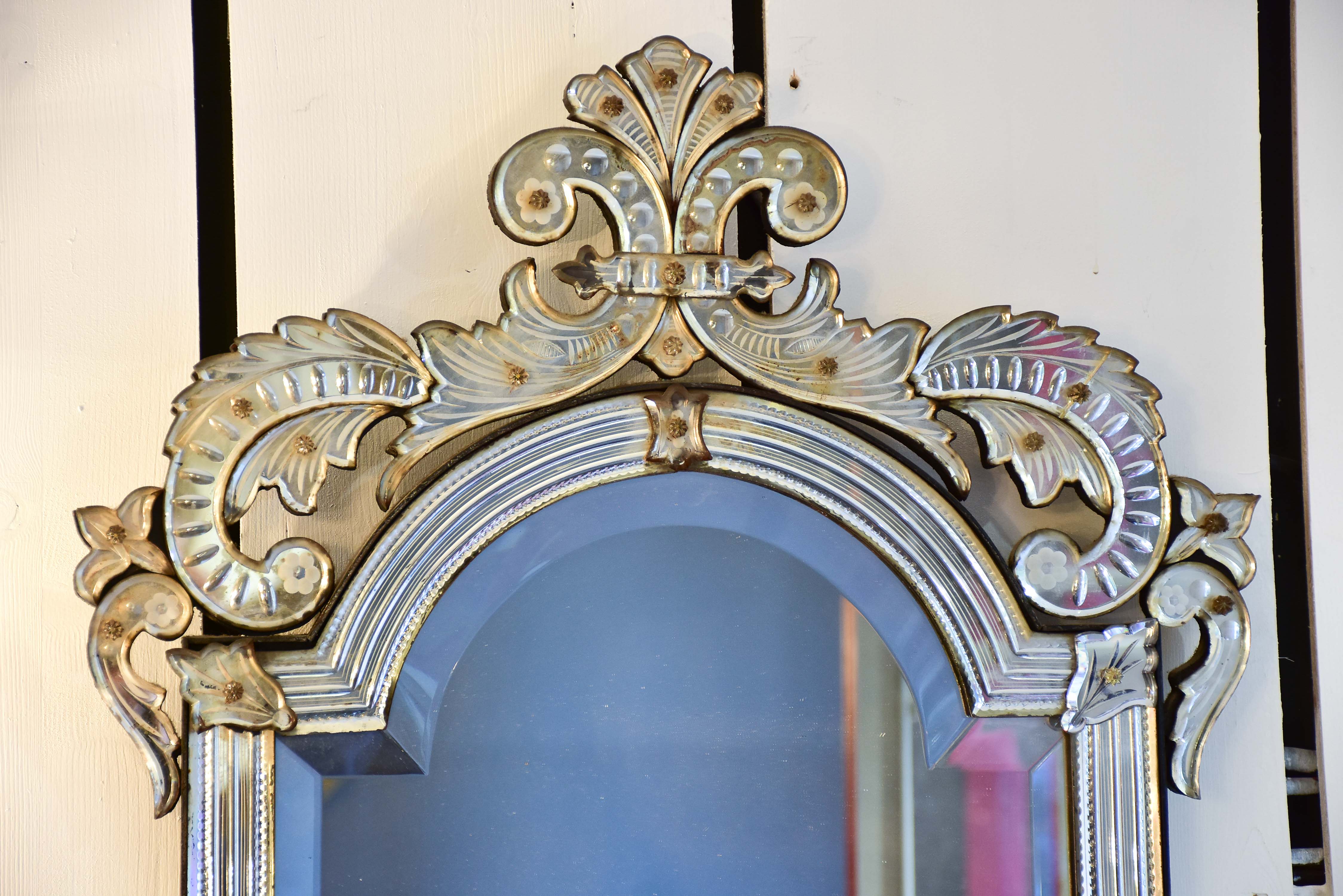 Antique Venetian mirror with decorative frame