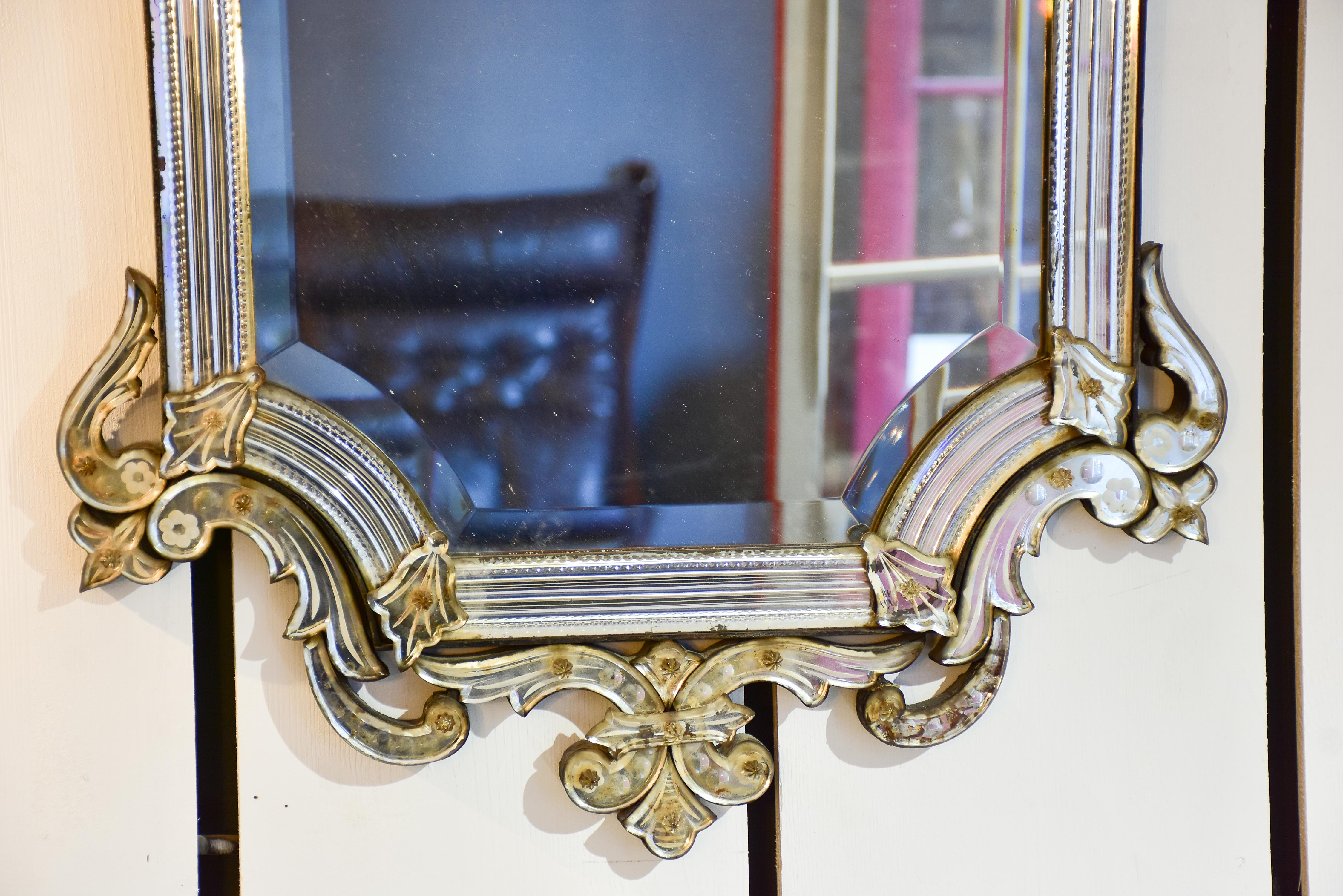 Antique Venetian mirror with decorative frame