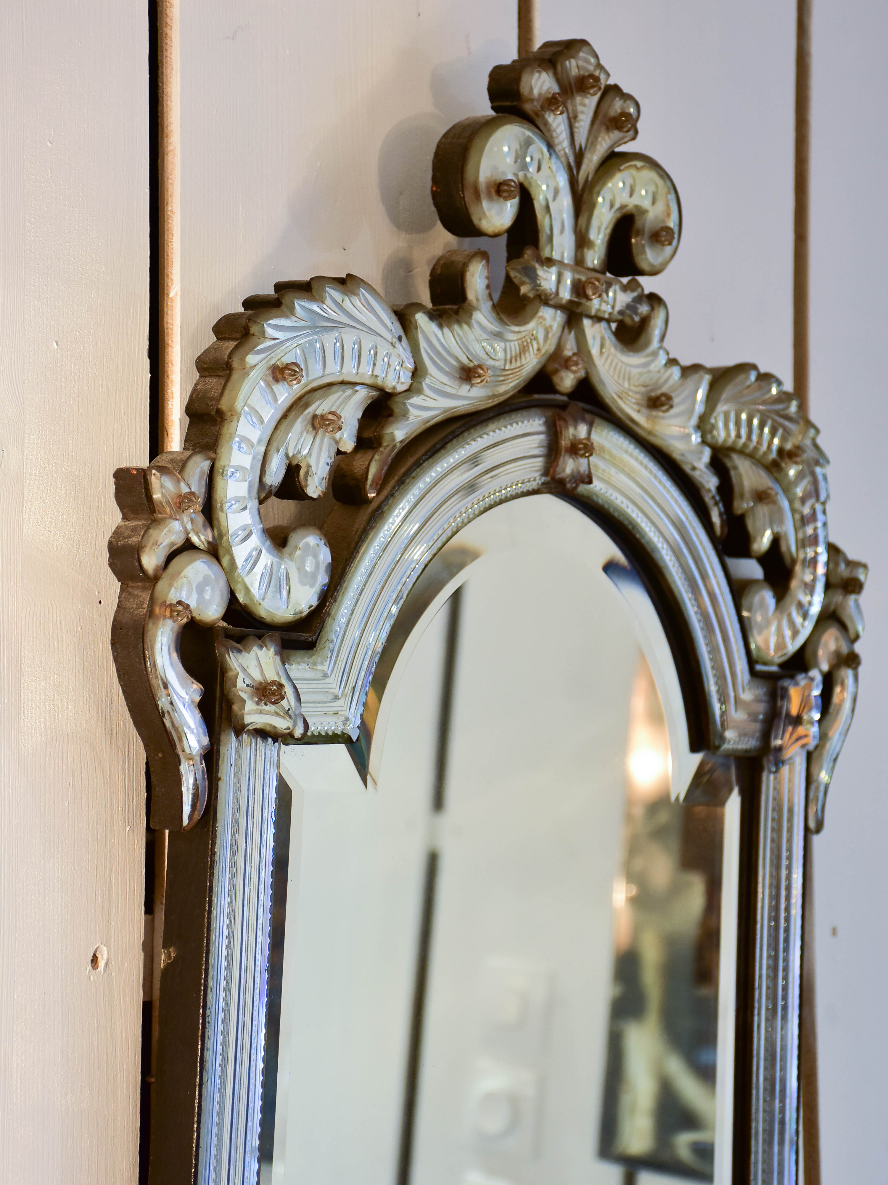 Antique Venetian mirror with decorative frame