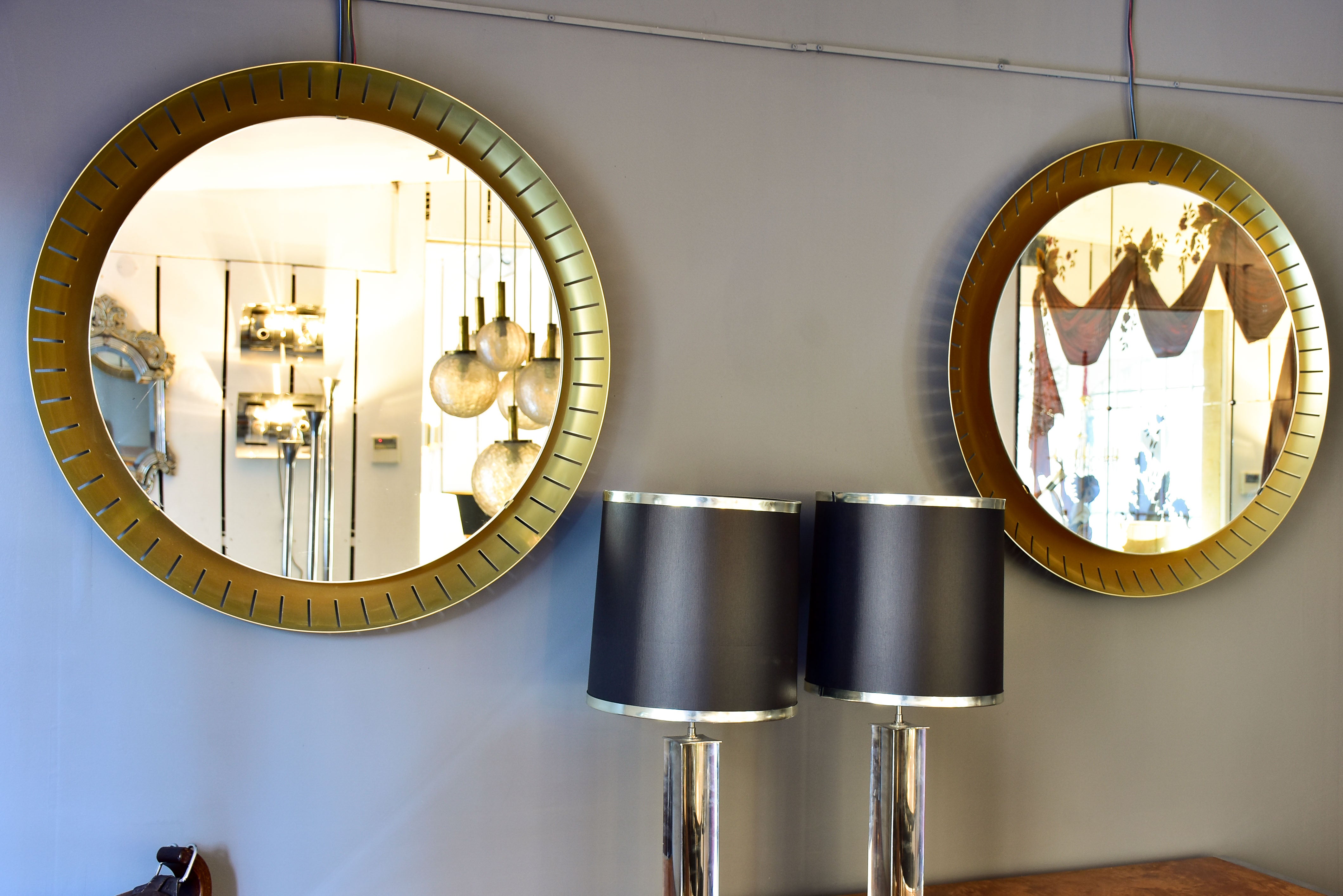 Pair of large round illuminated Stilnovo mirrors