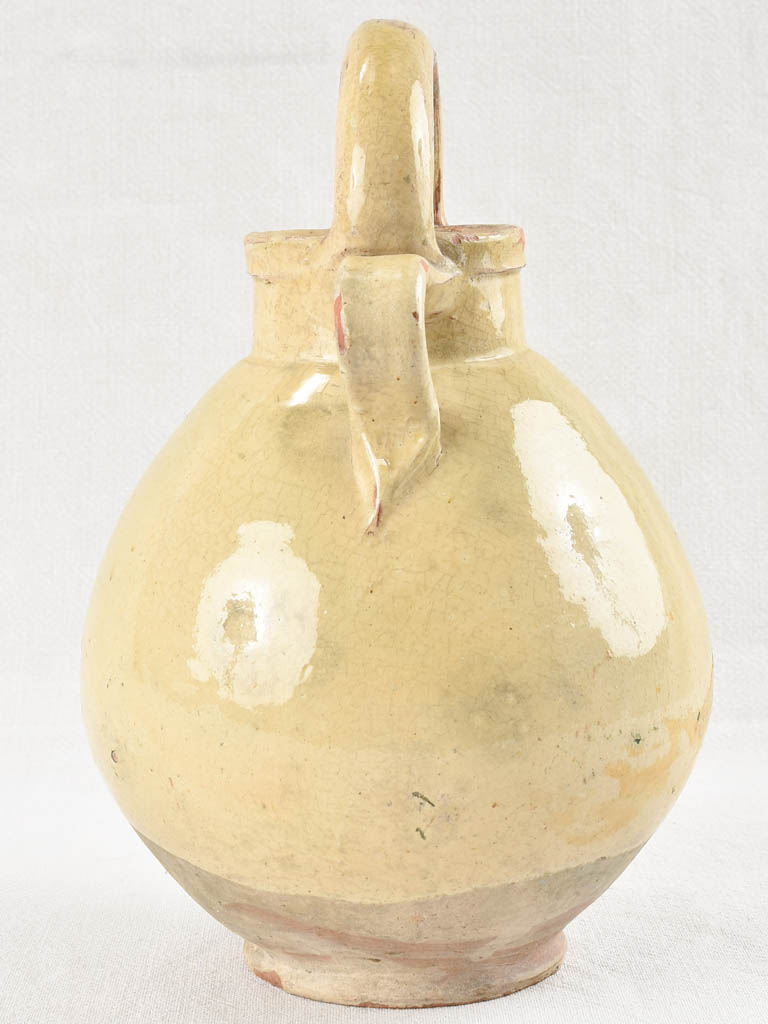 19th century terracotta water pitcher with yellow glaze 13½"