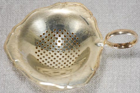 Antiquated silver-plated English tea strainer