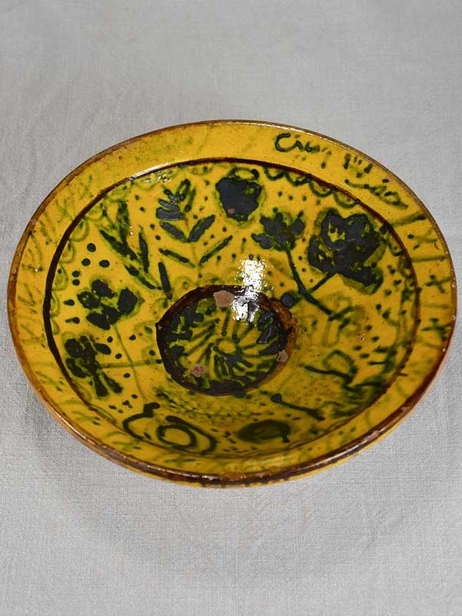 Antique folk art terracotta bowl with yellow glaze 11½"