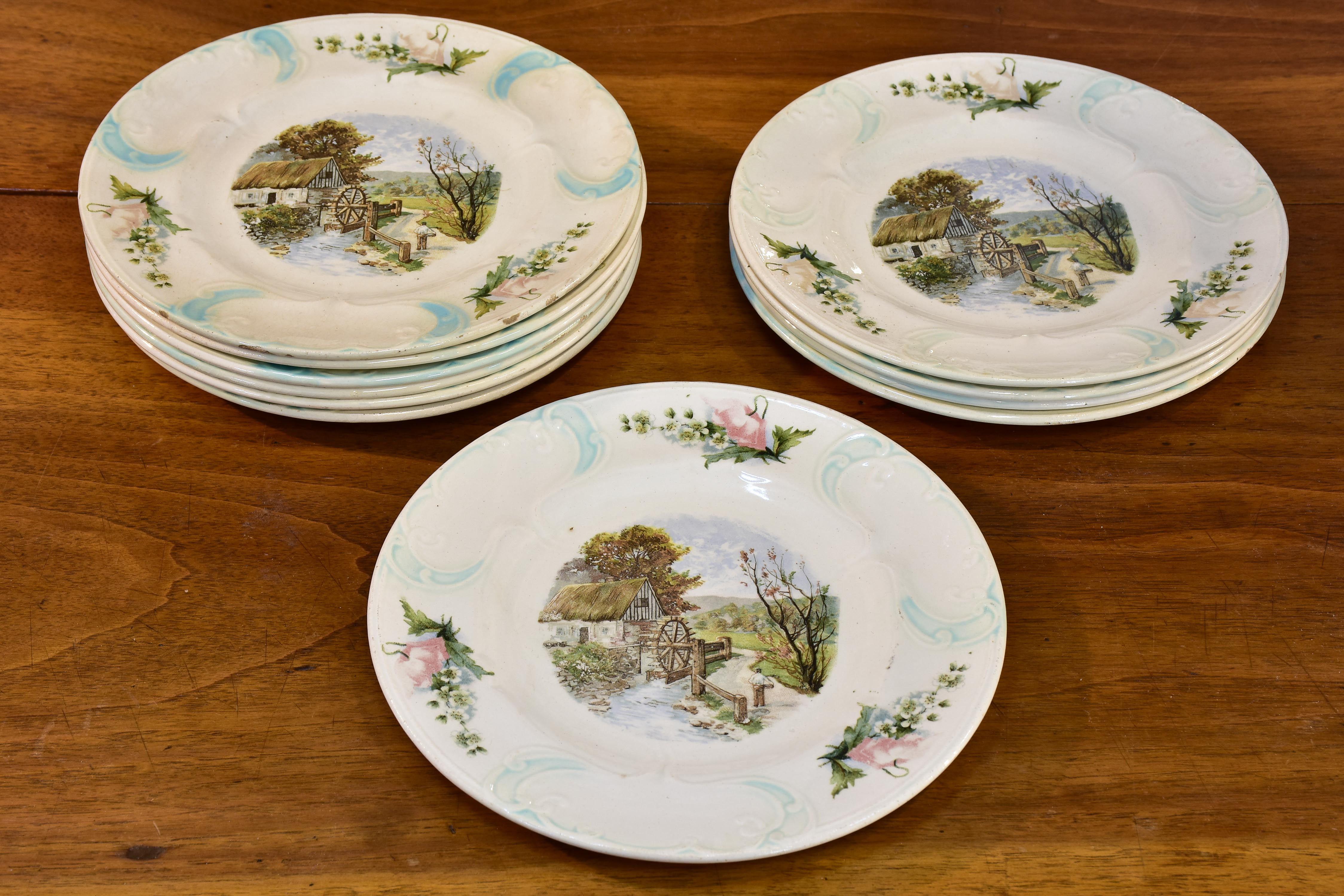 11 French faïence earthernware plates with country scene