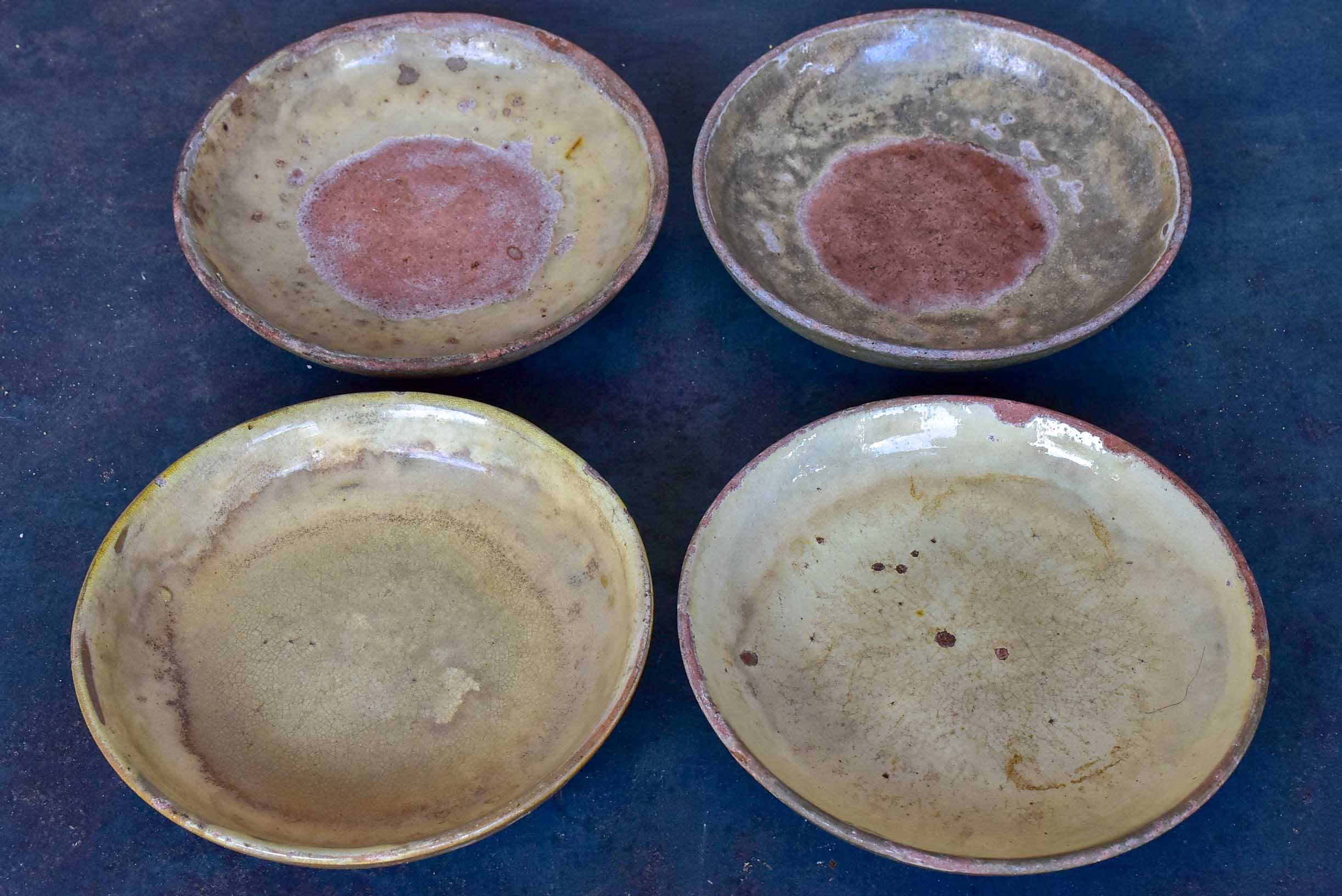 Four rustic French terracotta plates