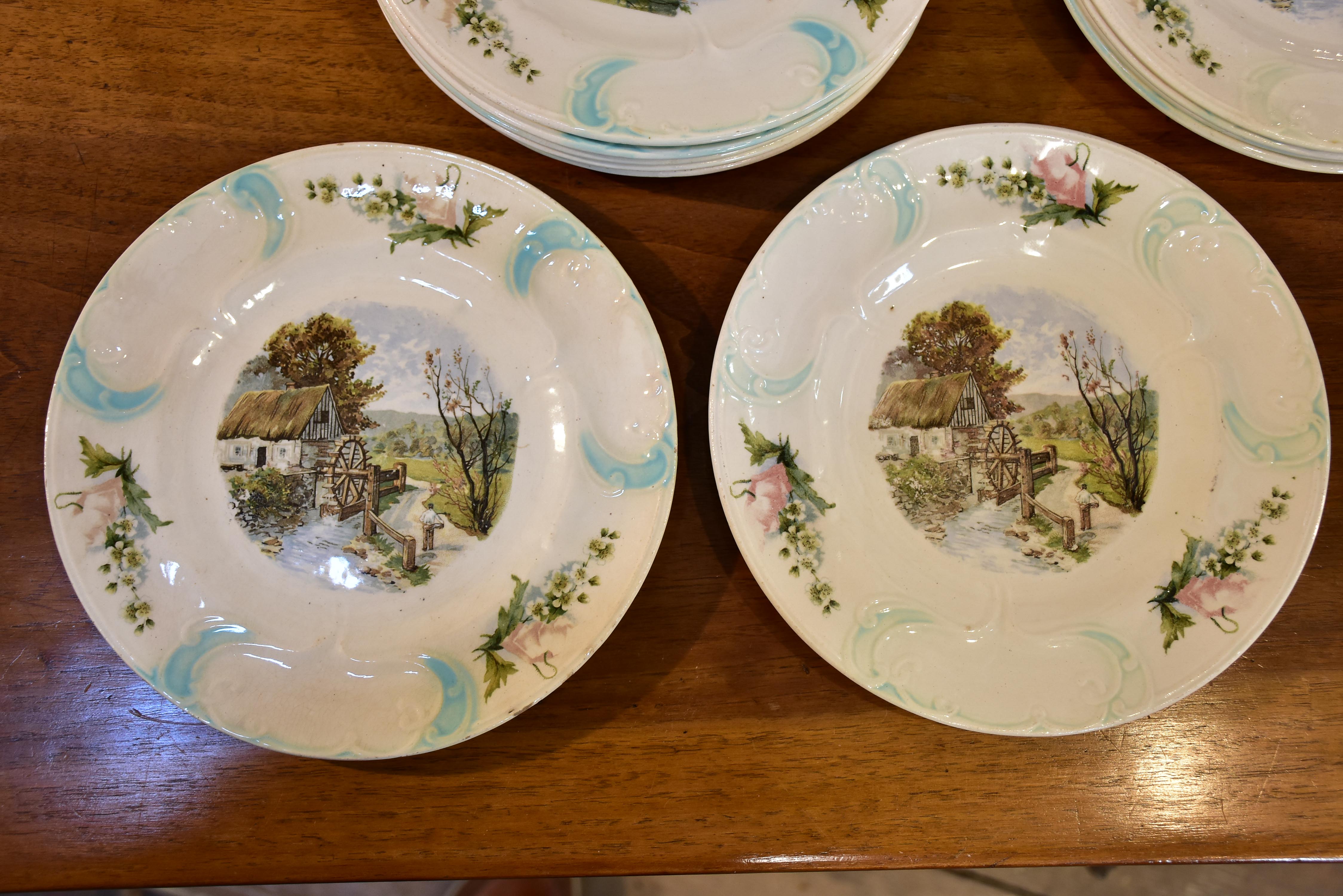 11 French faïence earthernware plates with country scene