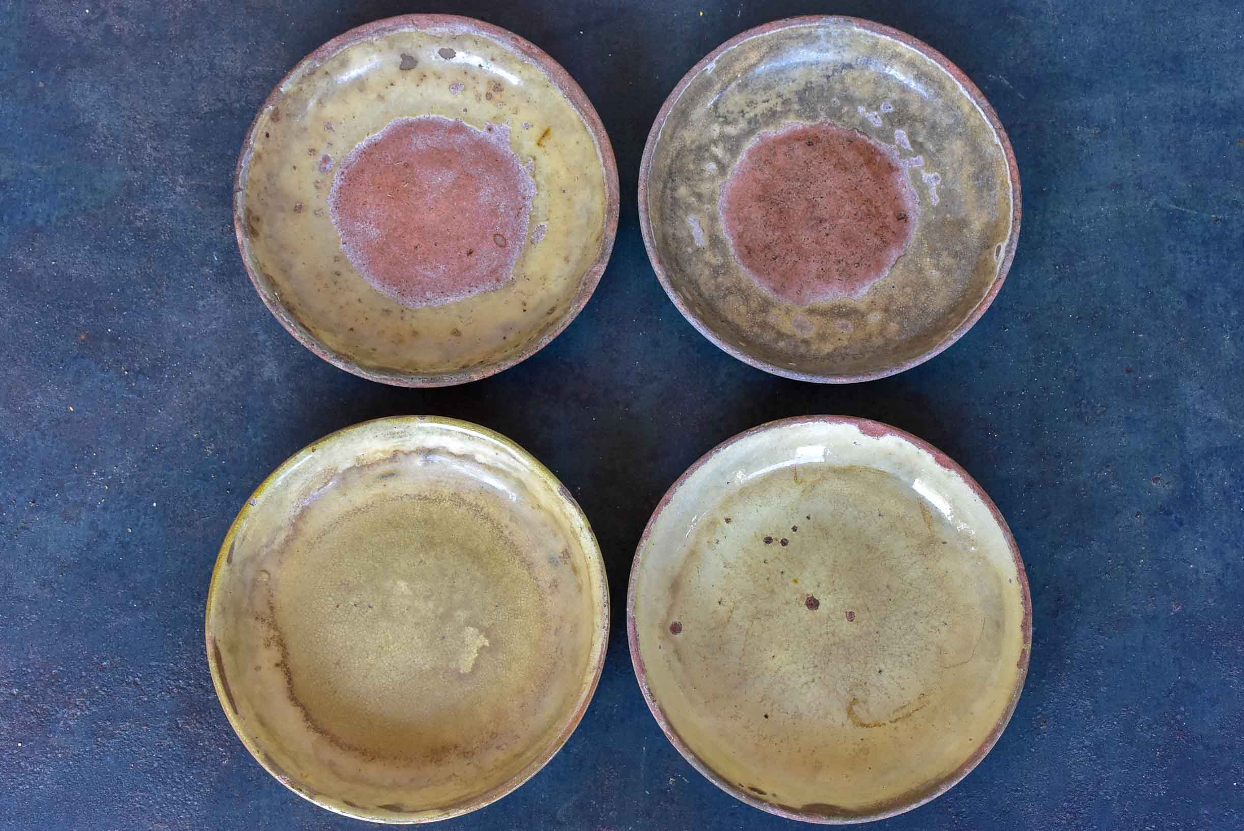 Four rustic French terracotta plates