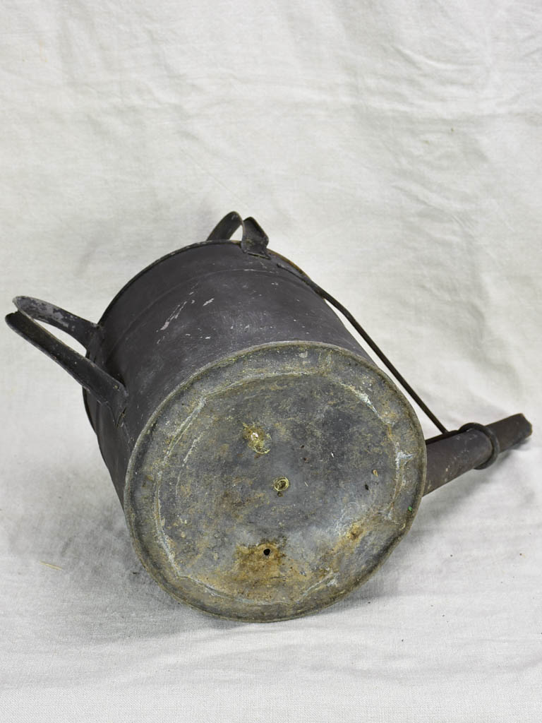 Antique English watering can with black painted finish