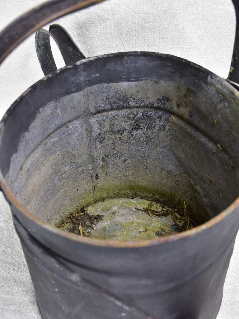 Antique English watering can with black painted finish