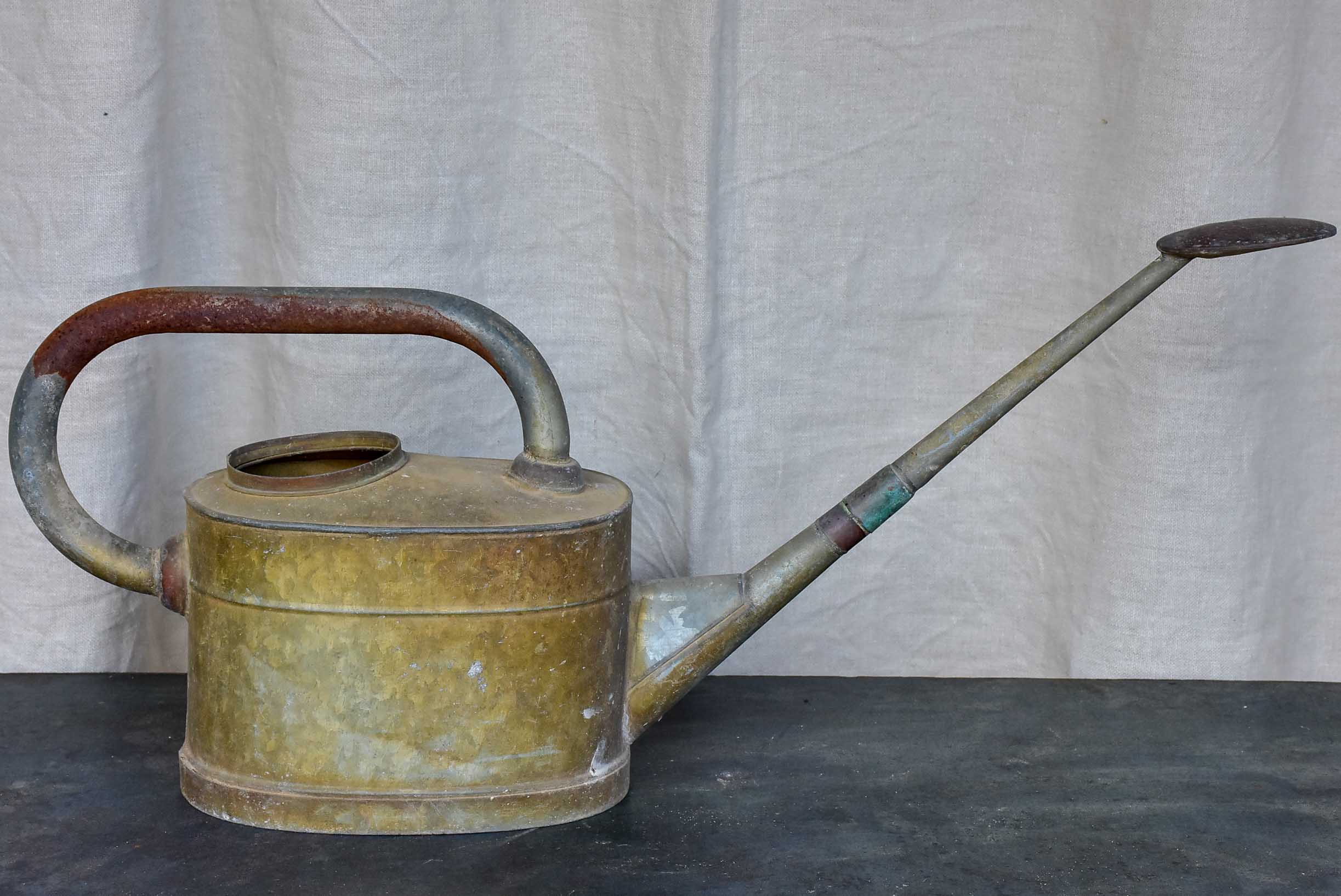 Antique French watering can with long spout