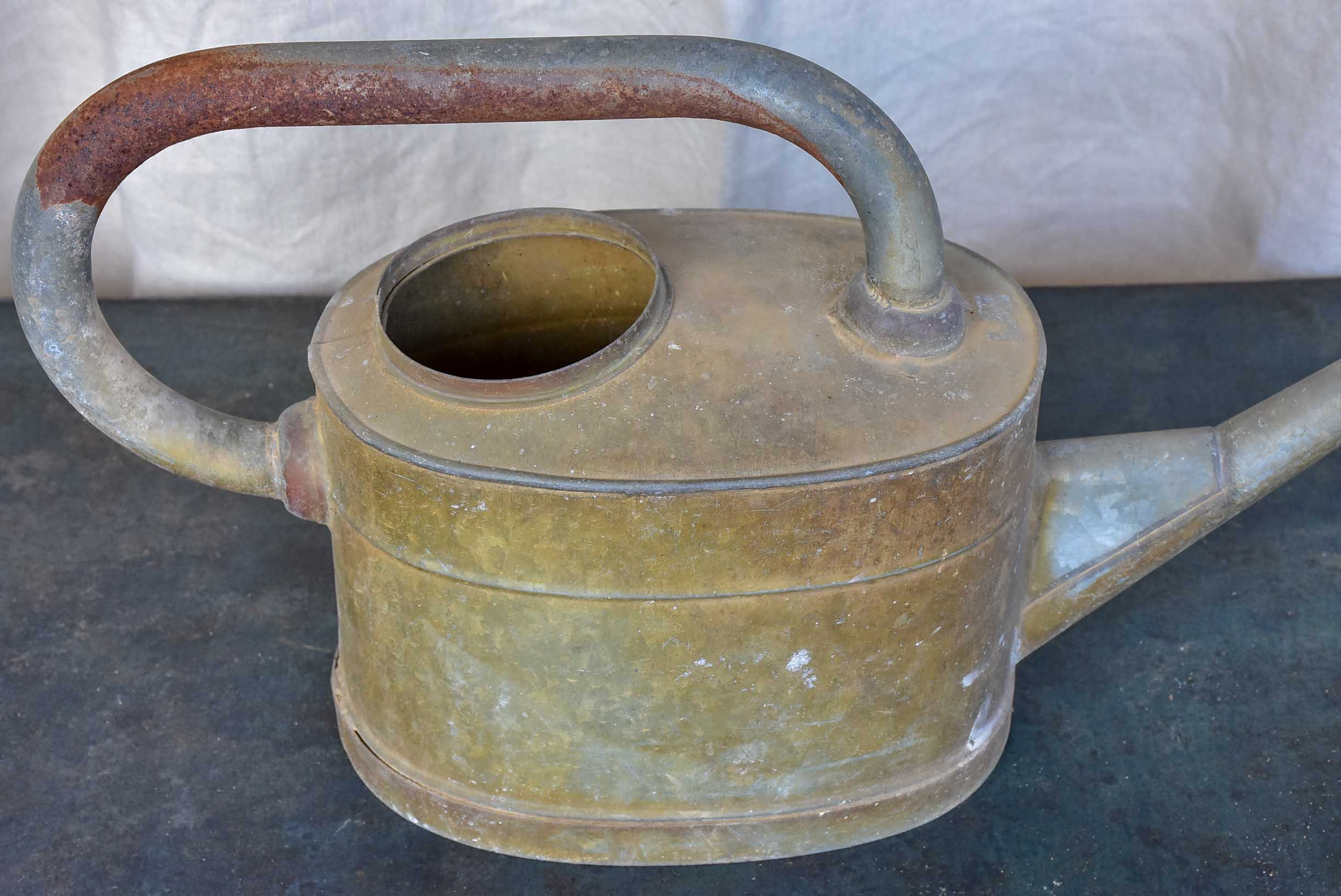 Antique French watering can with long spout