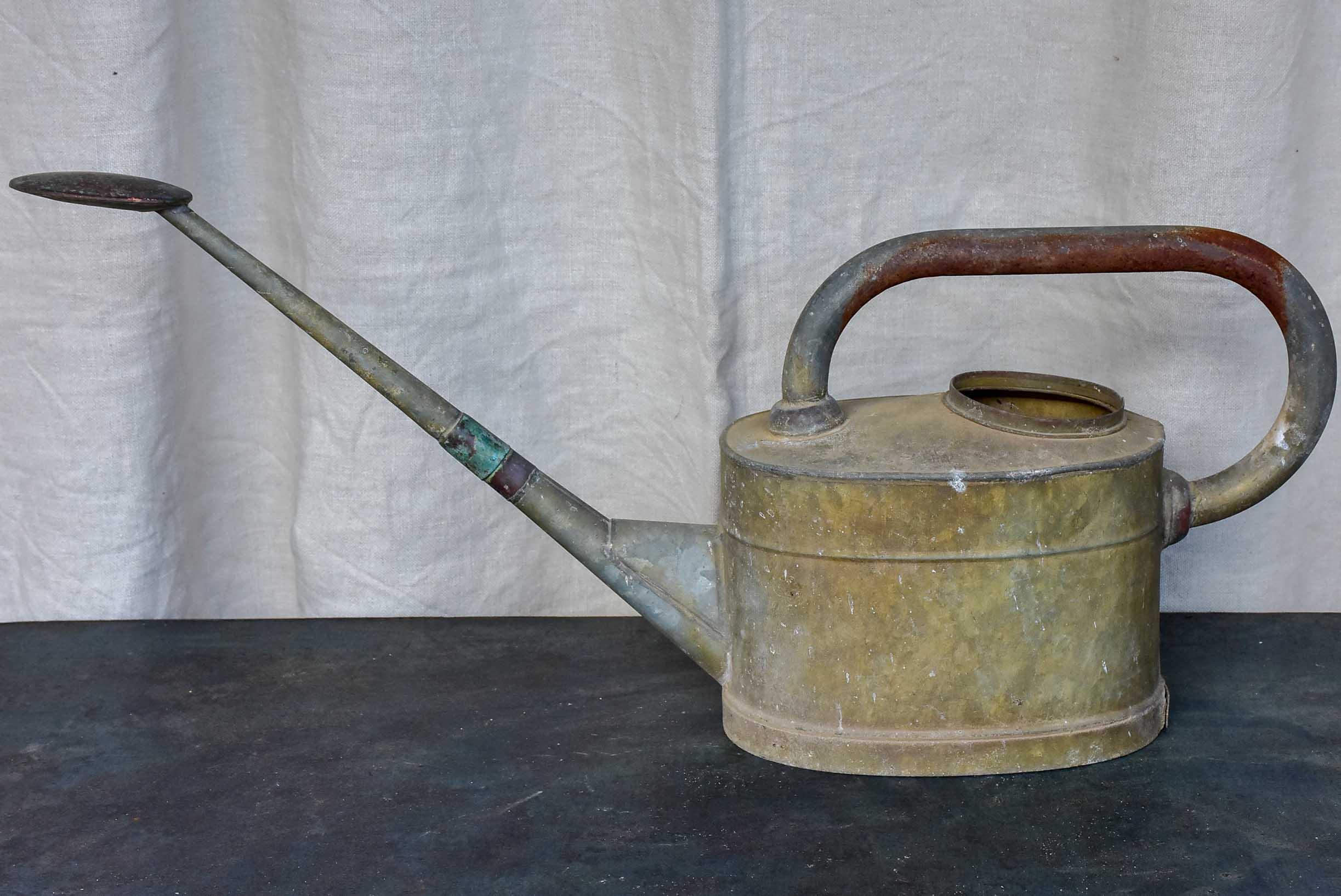 Antique French watering can with long spout