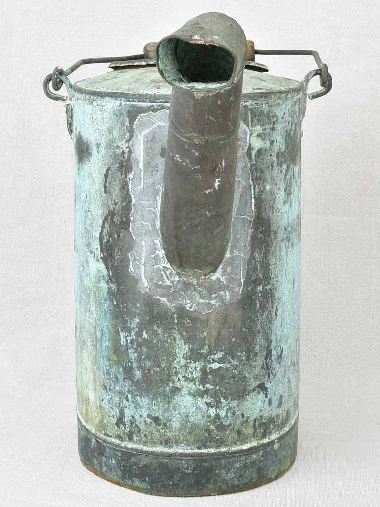 Antique French watering can with blue green atina