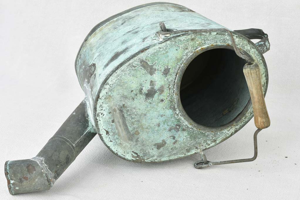 Antique French watering can with blue green atina