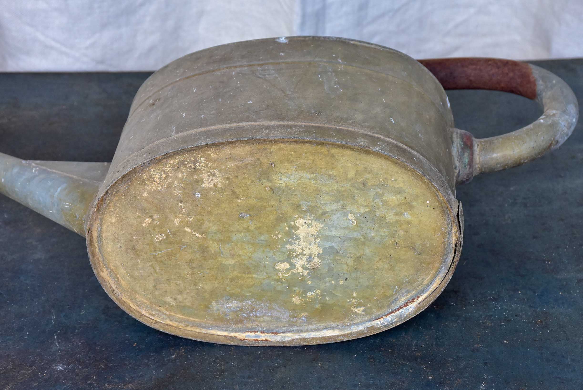 Antique French watering can with long spout