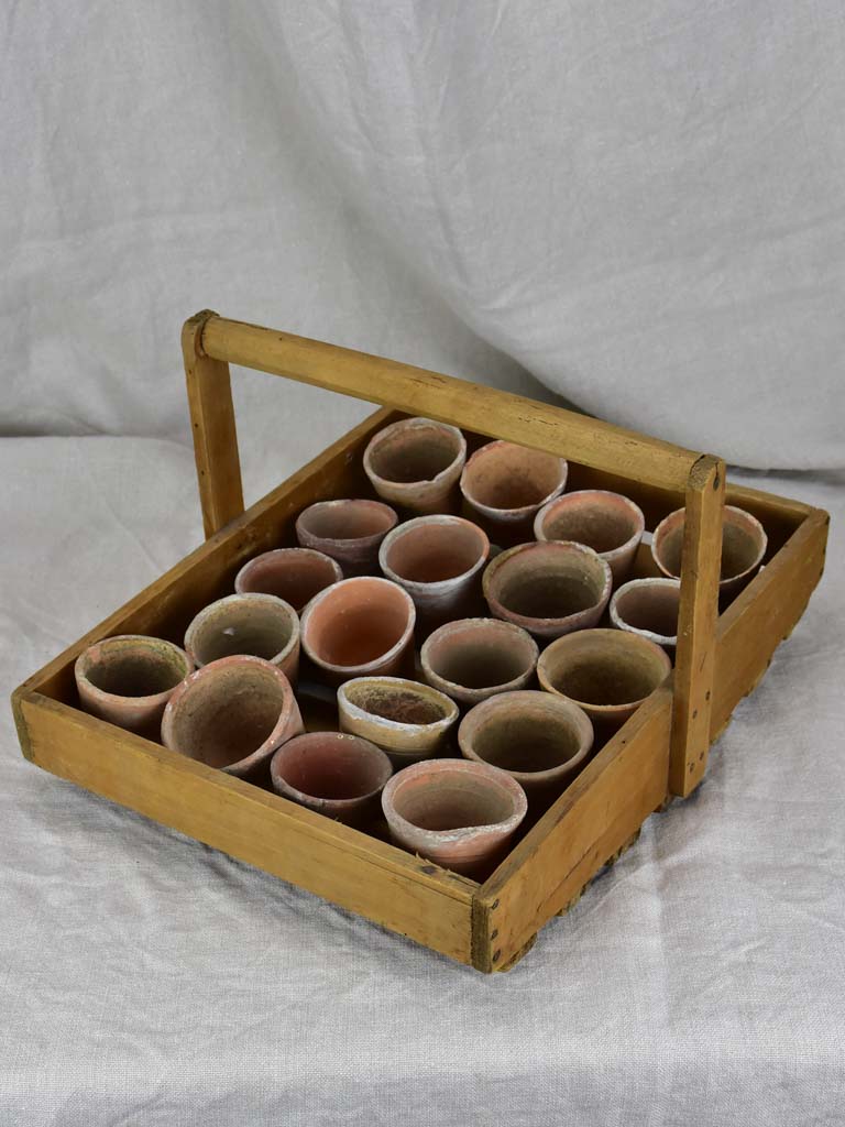 Antique French wooden potato harvest basket with terracotta pots