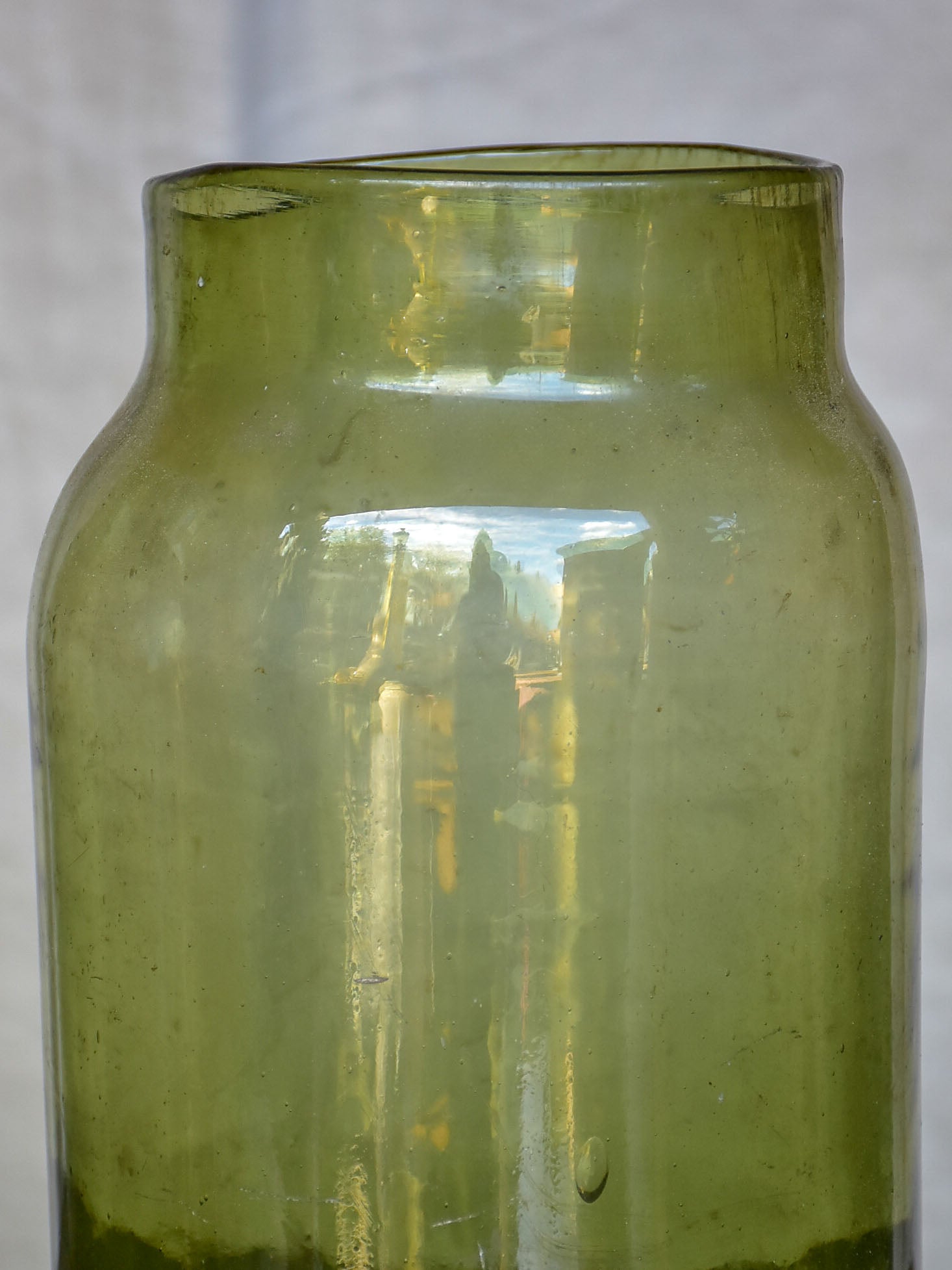 A pair of large late 19th Century green glass jars