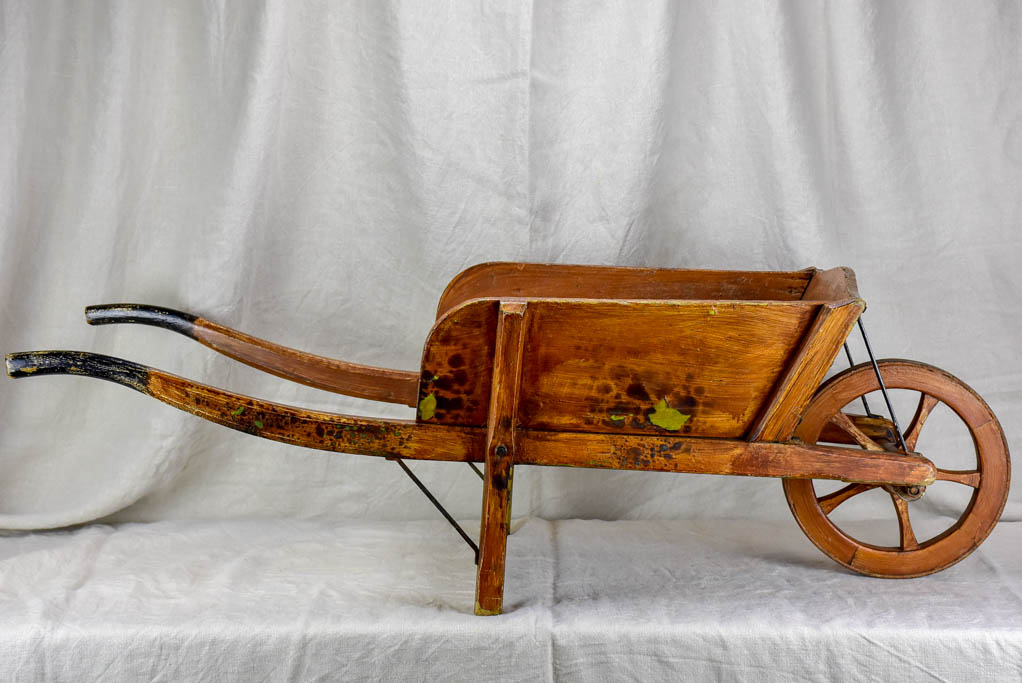 Antique French wooden wheelbarrow