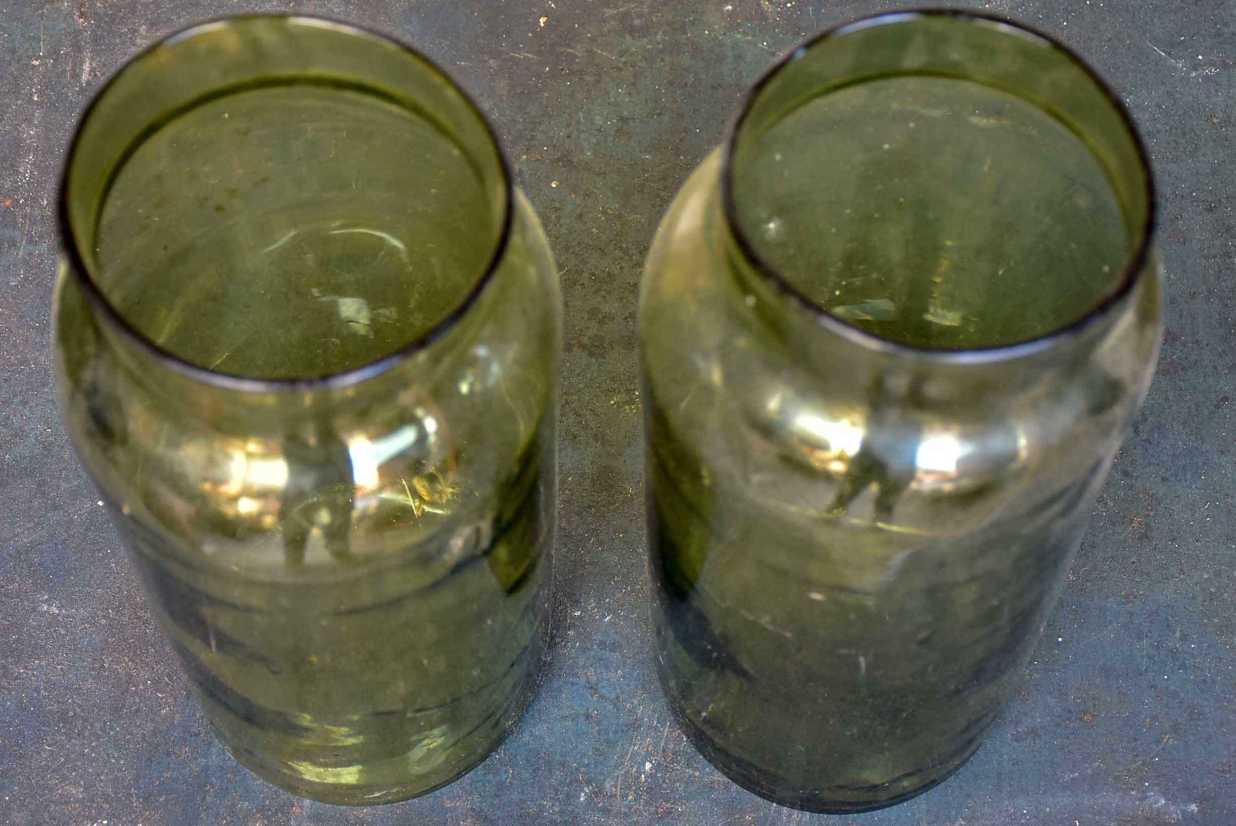 A pair of large late 19th Century green glass jars