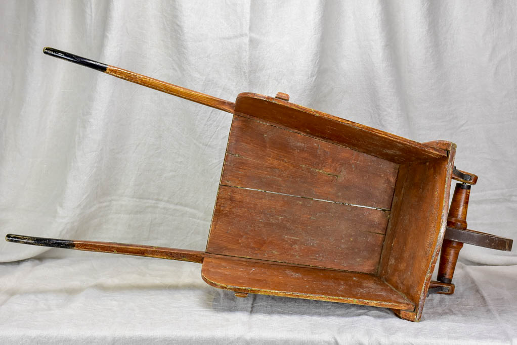 Antique French wooden wheelbarrow