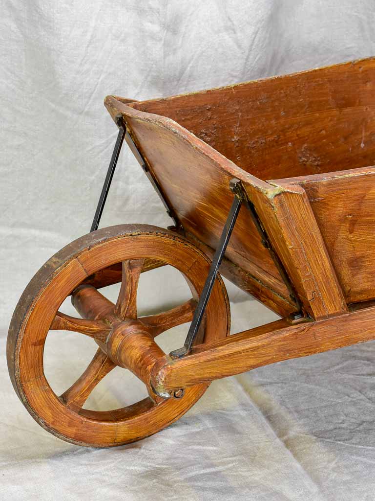 Antique French wooden wheelbarrow