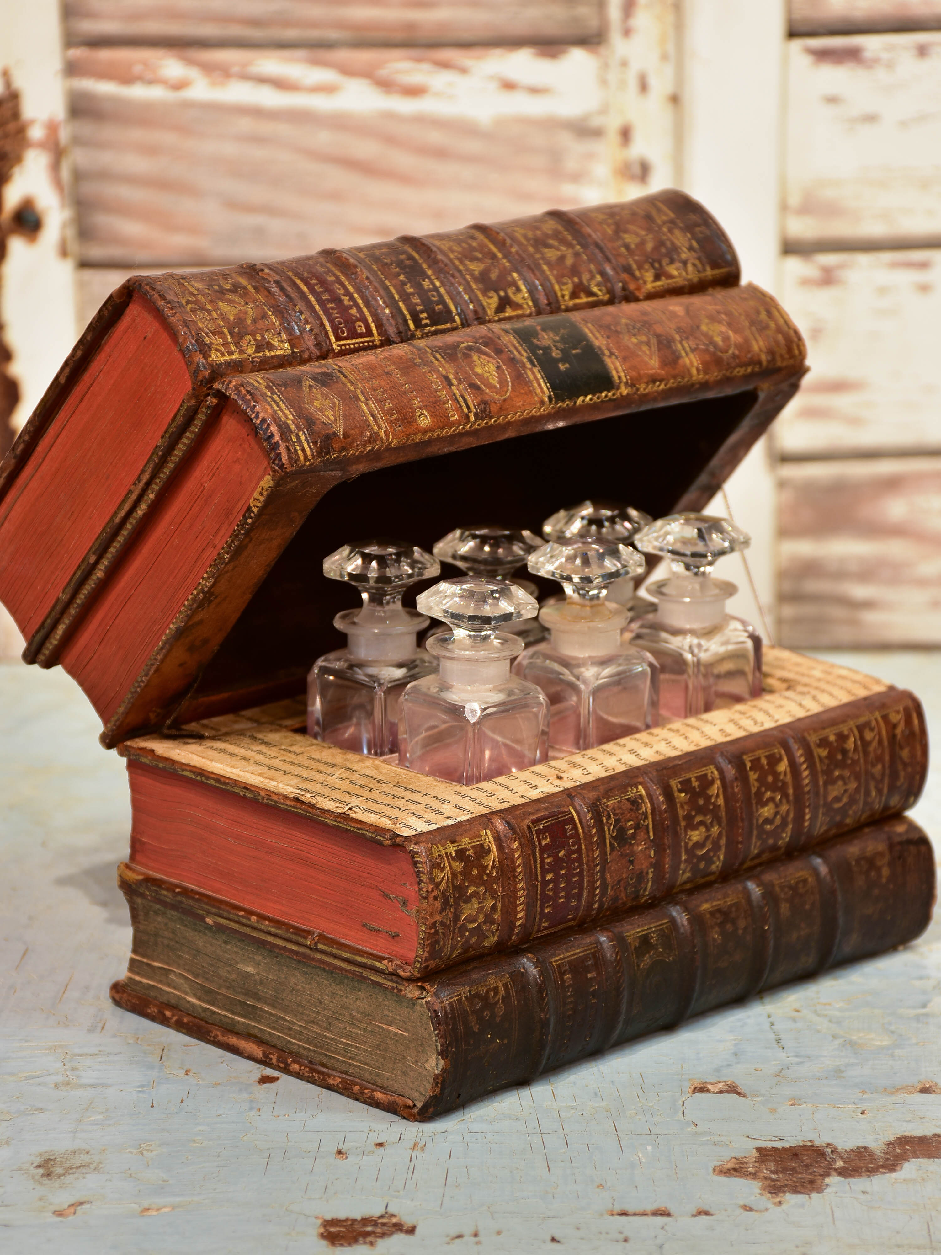 Antique French secret storage box with six perfume flasks