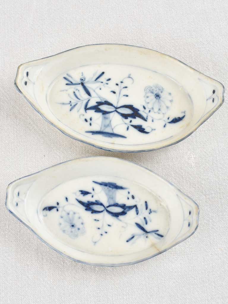 5 blue and white oval bowls