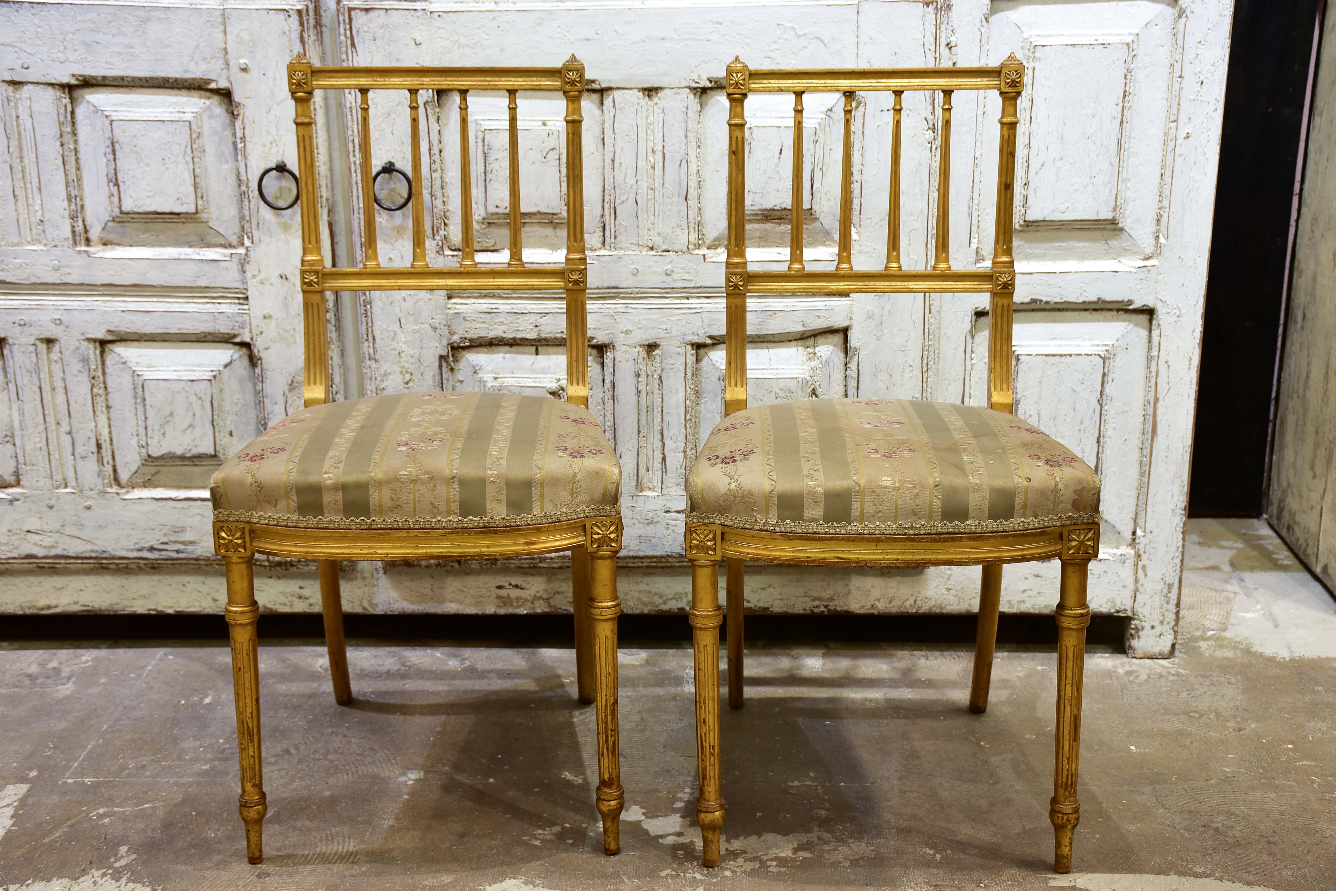 Pair of Louis XVI style gilded chairs