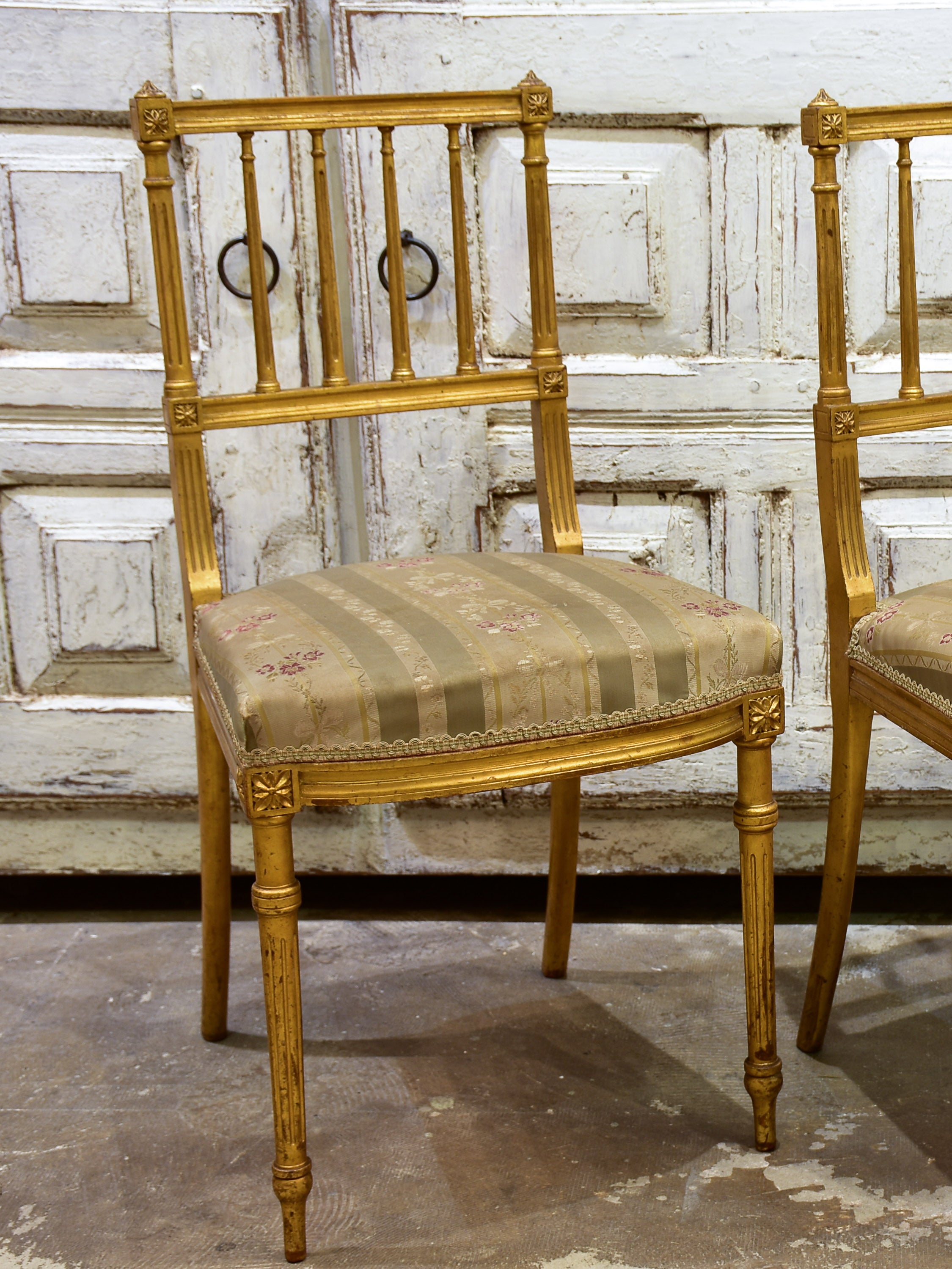 Pair of Louis XVI style gilded chairs