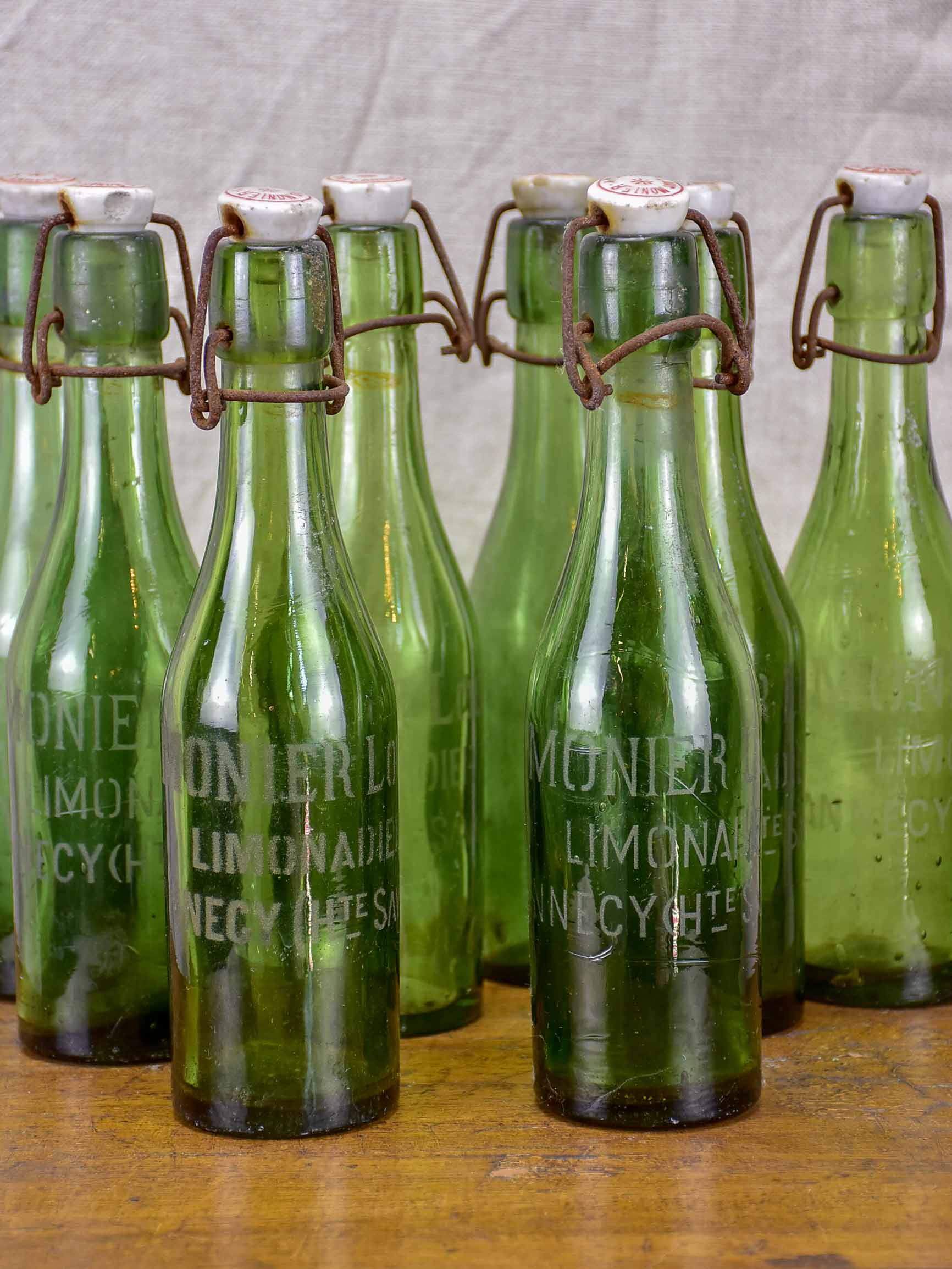 17 antique French lemonade bottles with ceramic stoppers