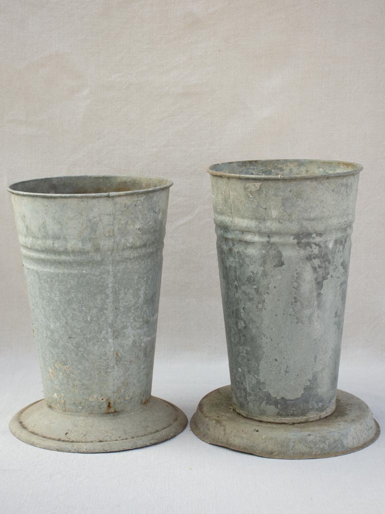 Two vintage zinc florist vases