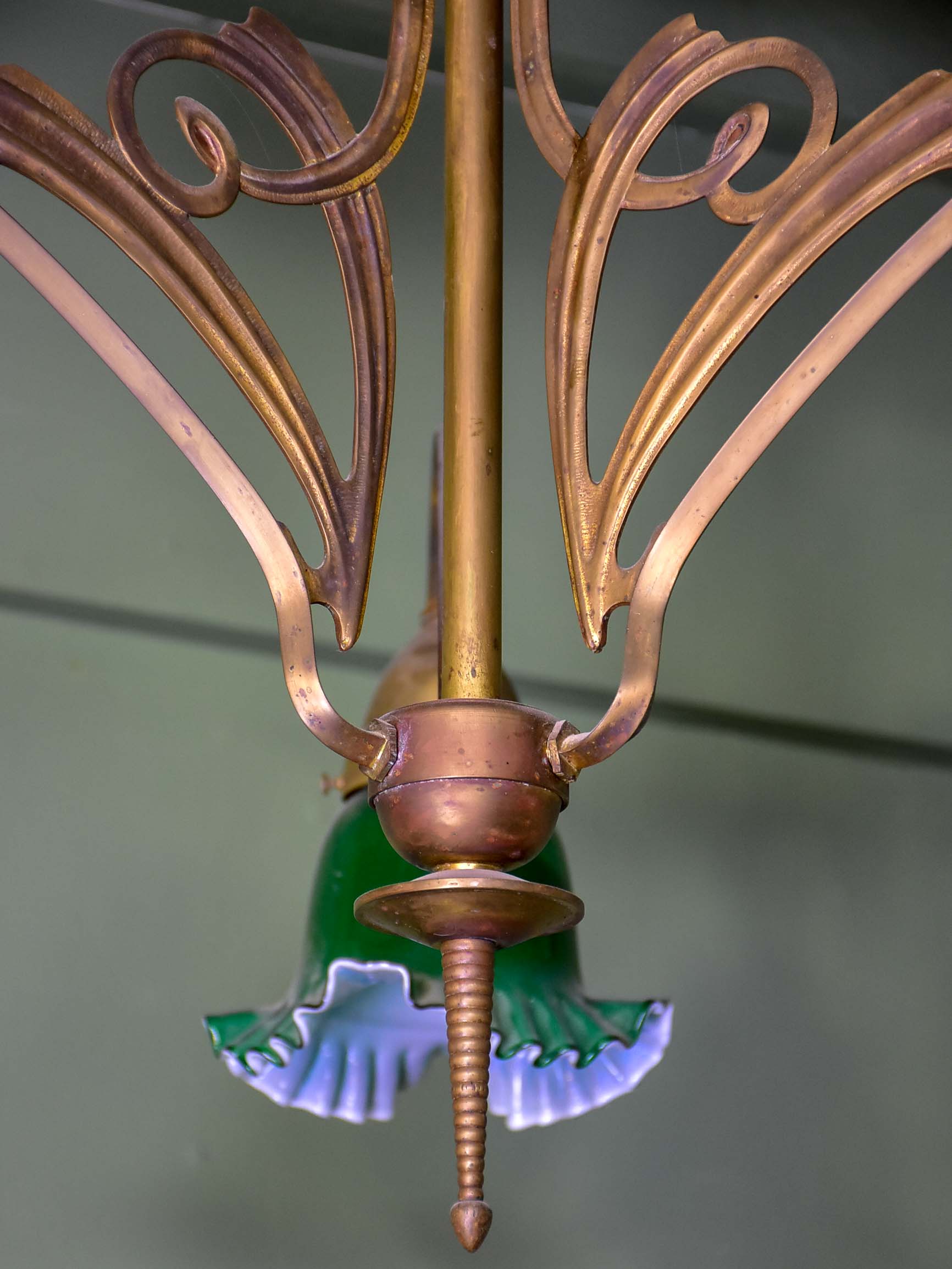 French Art Nouveau three light pendant with green glass lampshades