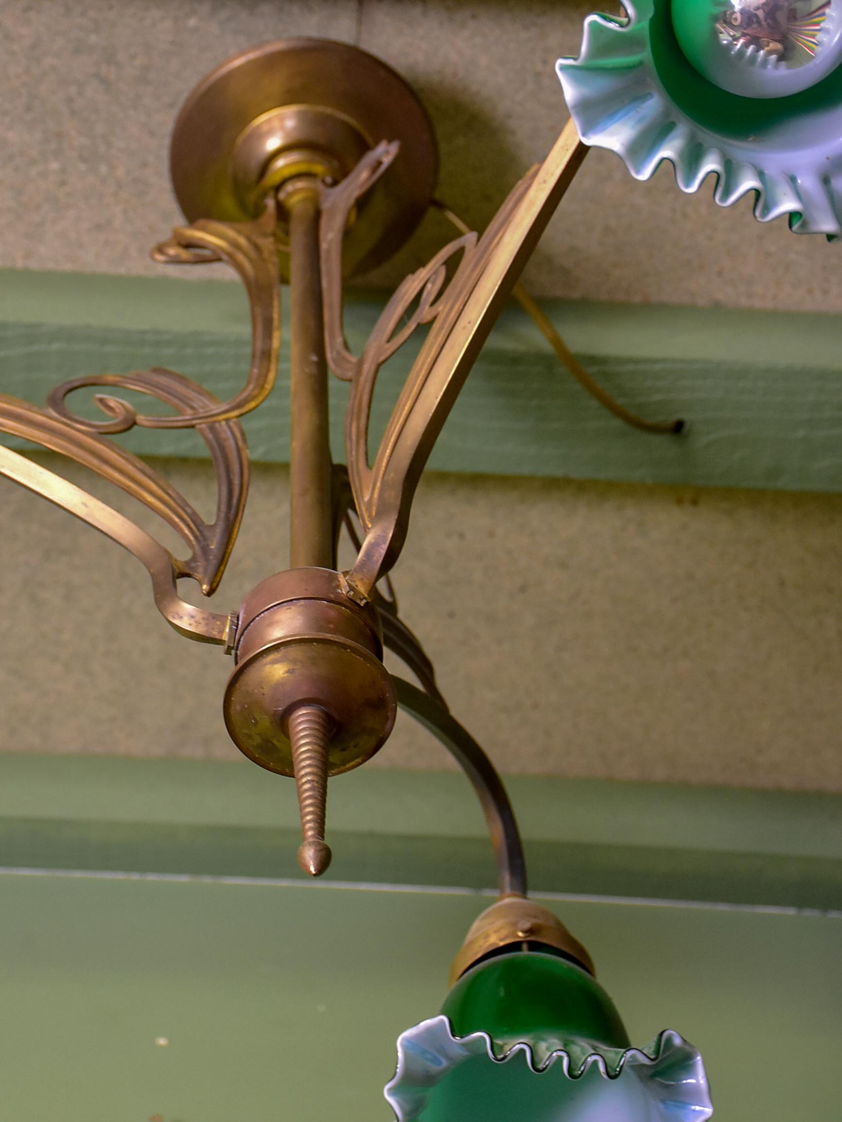 French Art Nouveau three light pendant with green glass lampshades