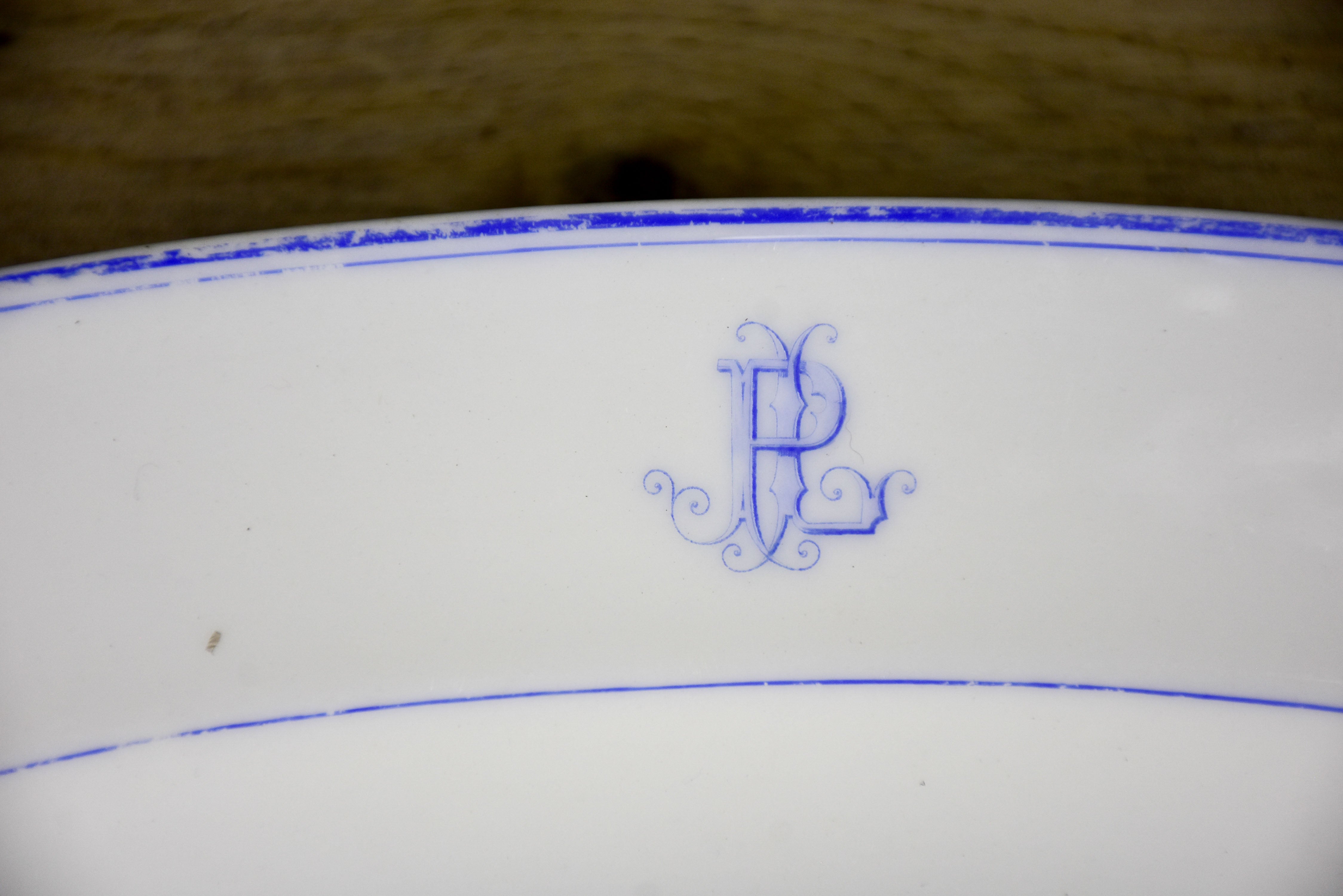 Two faïence platters with PL monogram