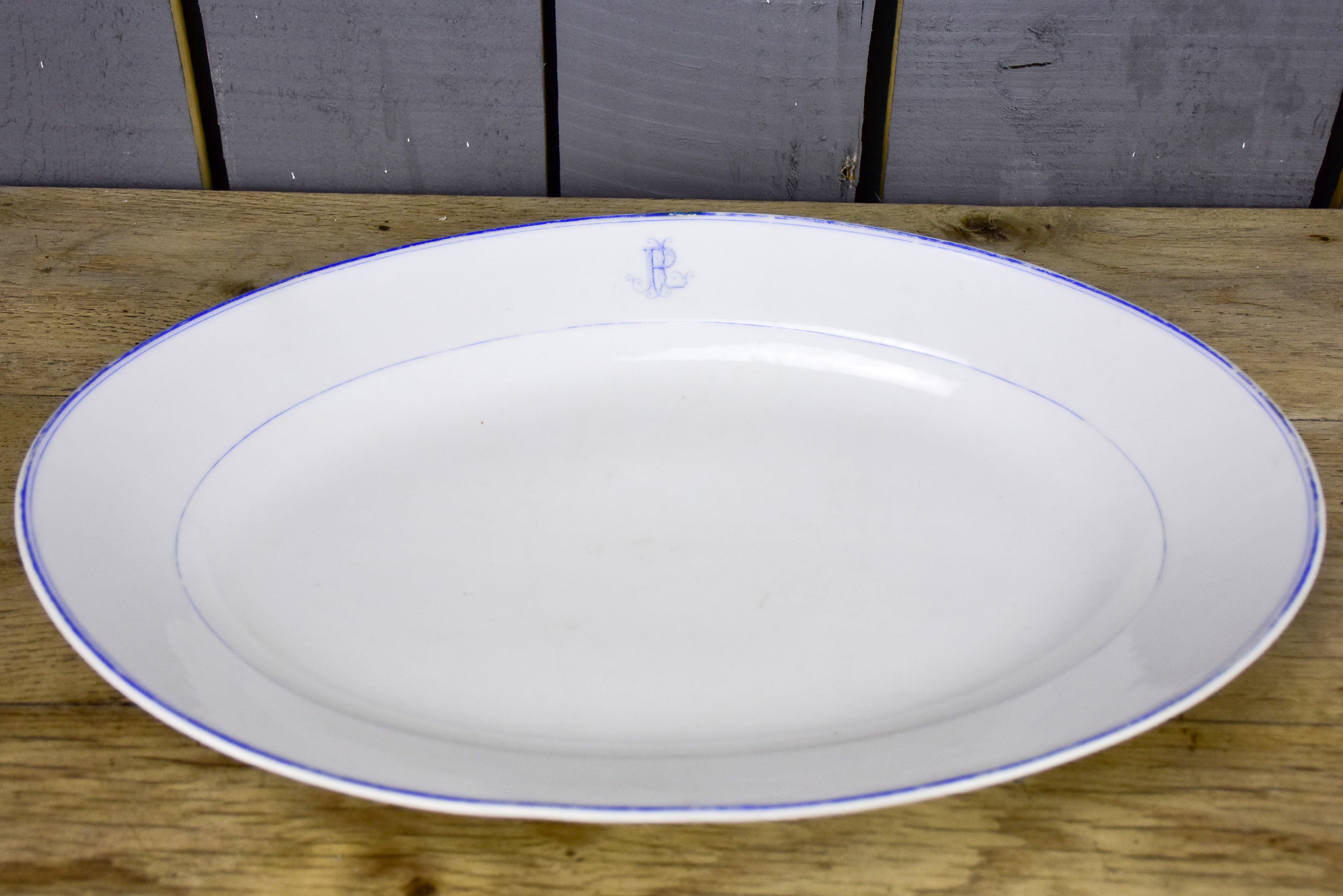 Two faïence platters with PL monogram