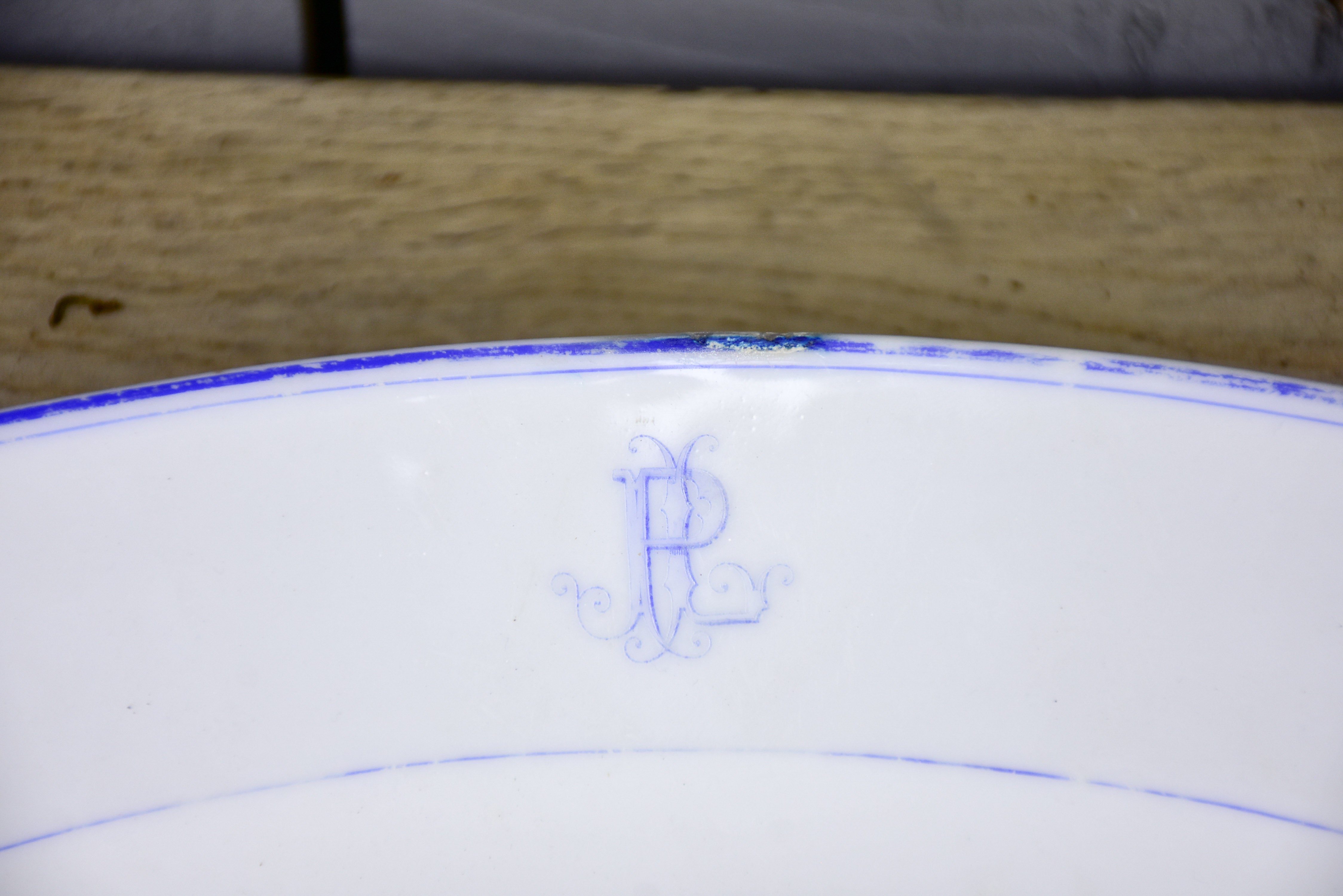 Two faïence platters with PL monogram