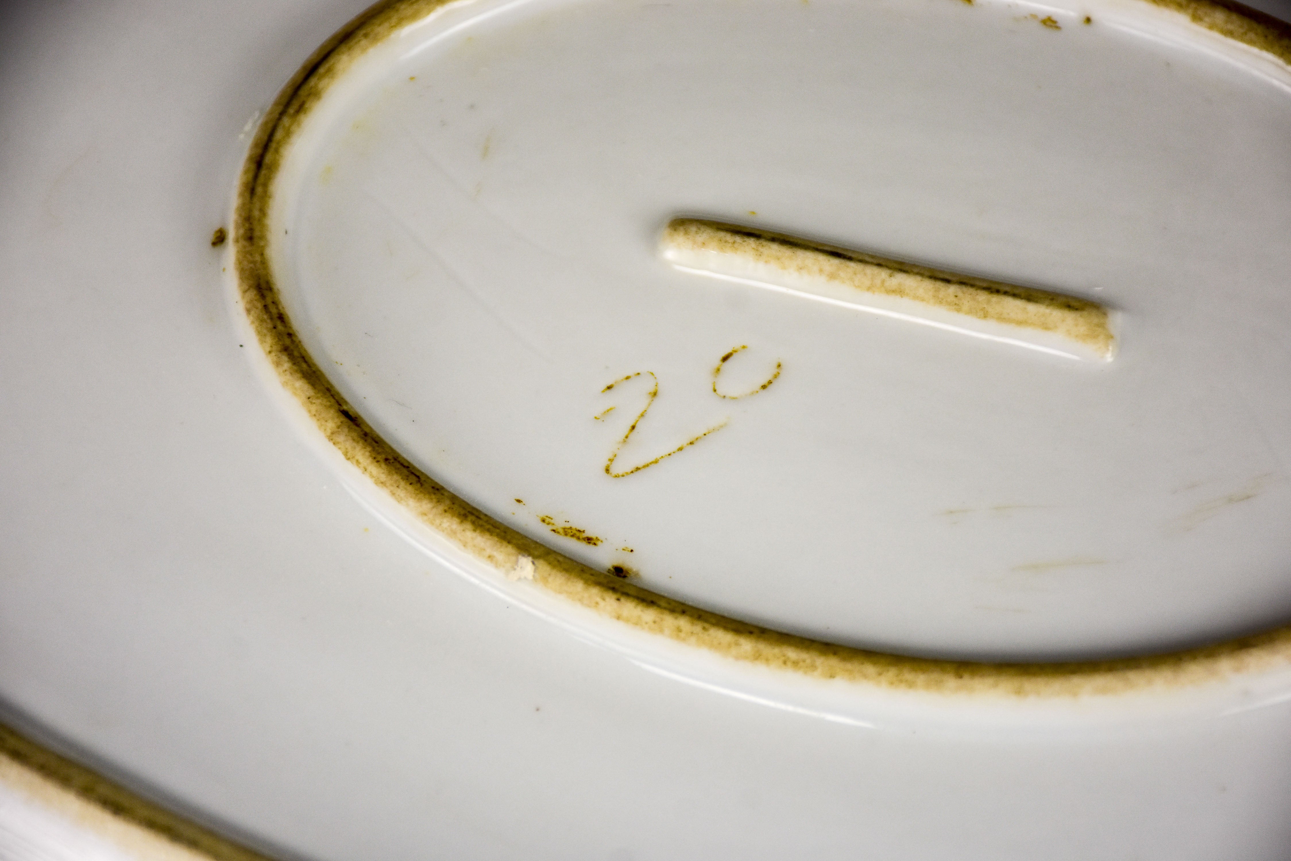 Two faïence platters with PL monogram