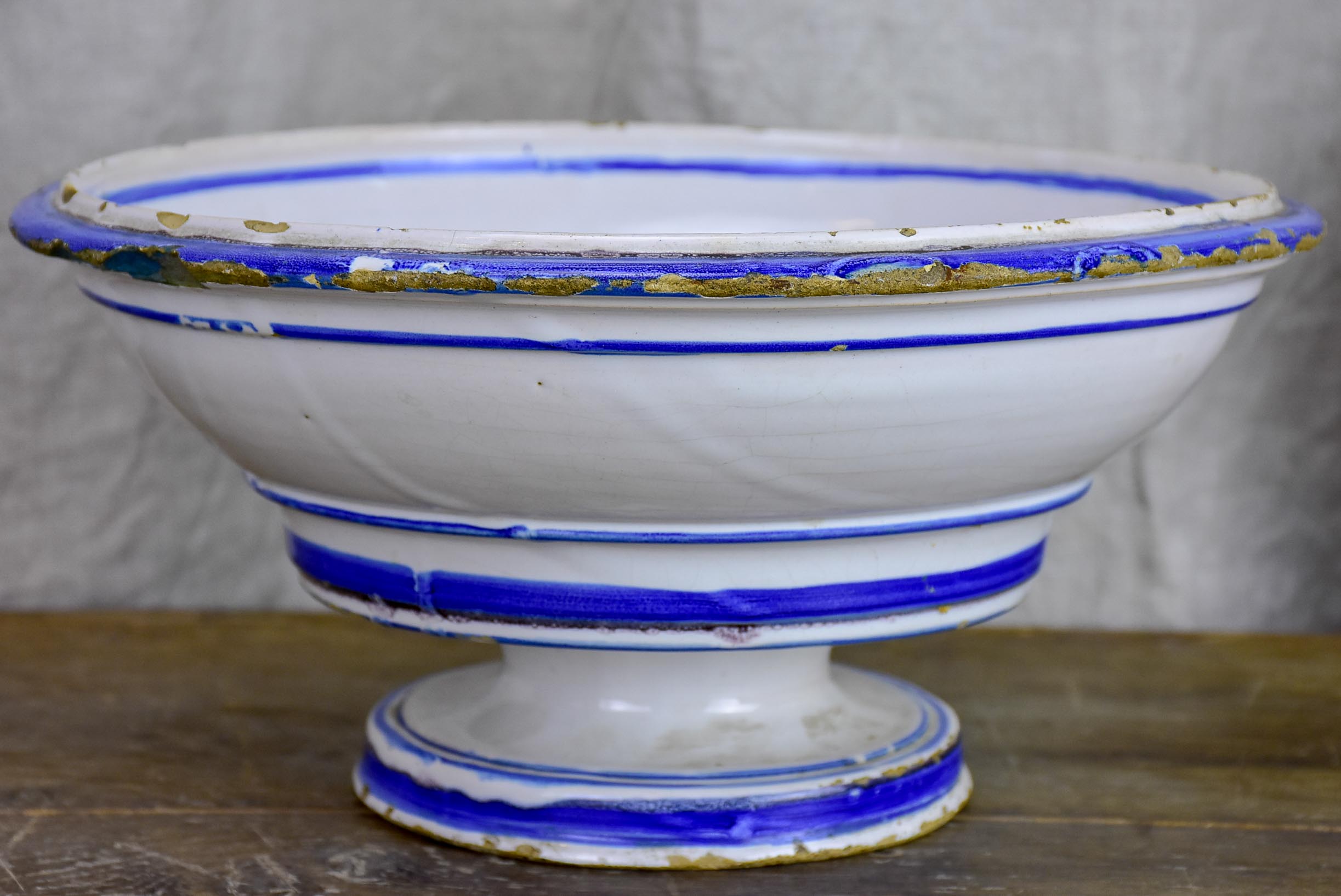 Antique fruit bowl with blue and white glaze